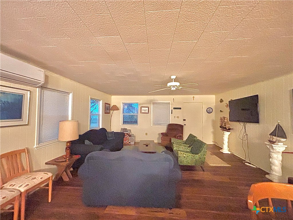 1008 Adams Avenue Port O'Connor, TX 77982 - Photo 17 of 43 a living room with furniture and a flat screen tv
