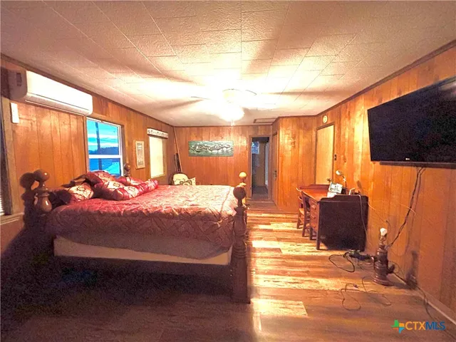 a view of a porch with furniture and a yard