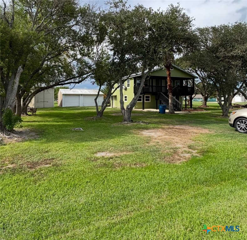 1008 Adams Avenue Port O'Connor, TX 77982 - Photo 20 of 43 a view of a house with a yard