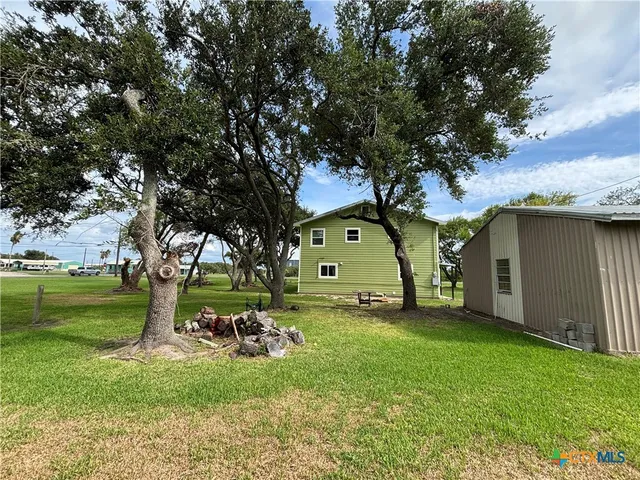a bed room with a bed and a chandelier