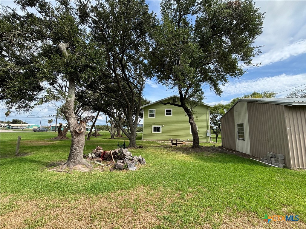 1008 Adams Avenue Port O'Connor, TX 77982 - Photo 23 of 43 a view of a house with a yard
