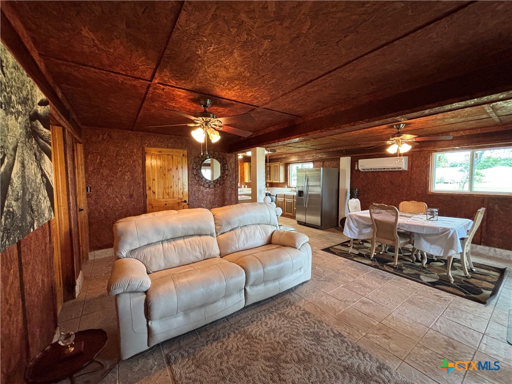 1008 Adams Avenue Port O'Connor, TX 77982 - Photo 24 of 43 a living room with furniture a couch and large windows
