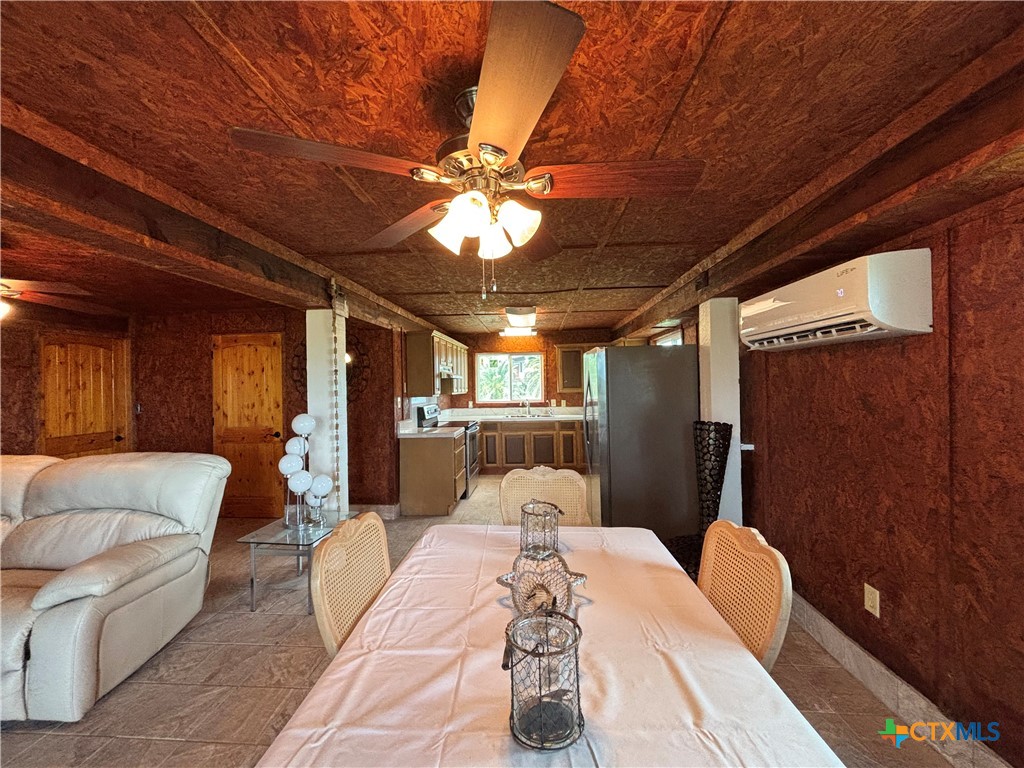 1008 Adams Avenue Port O'Connor, TX 77982 - Photo 25 of 43 a bed room with a bed and a chandelier