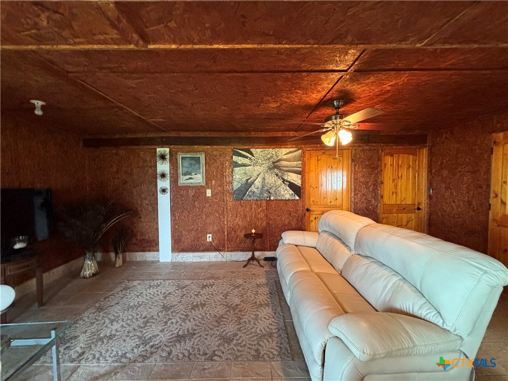1008 Adams Avenue Port O'Connor, TX 77982 - Photo 28 of 43 a living room with a couch and a flat screen tv