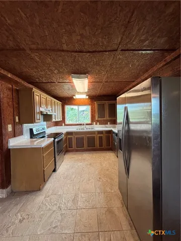 a bathroom with a bathtub and a sink