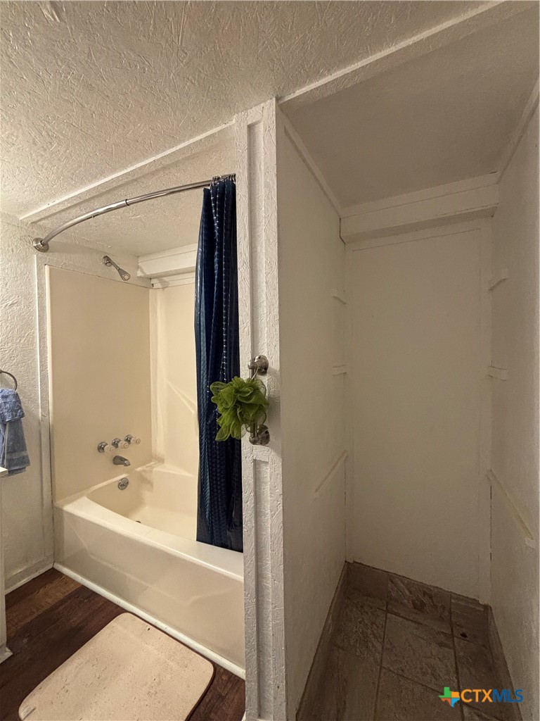 1008 Adams Avenue Port O'Connor, TX 77982 - Photo 34 of 43 a bathroom with a bathtub and a sink