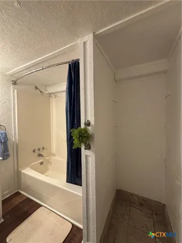 a view of a room that has a window in it