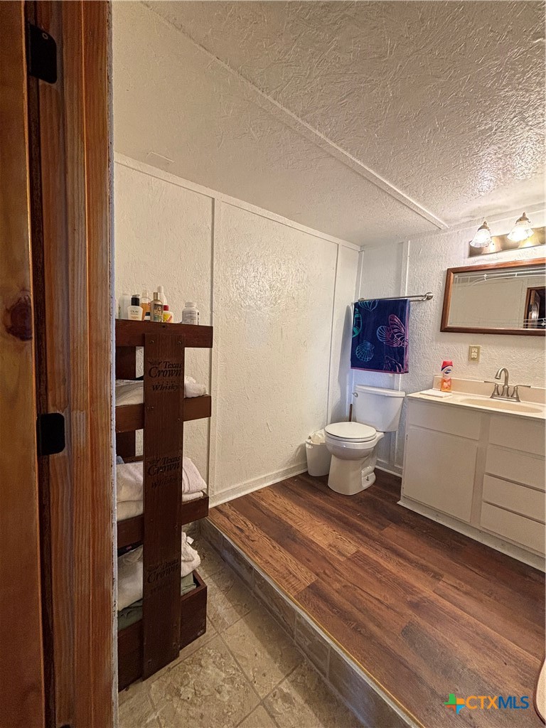 1008 Adams Avenue Port O'Connor, TX 77982 - Photo 35 of 43 a spacious bathroom with a toilet sink and shower
