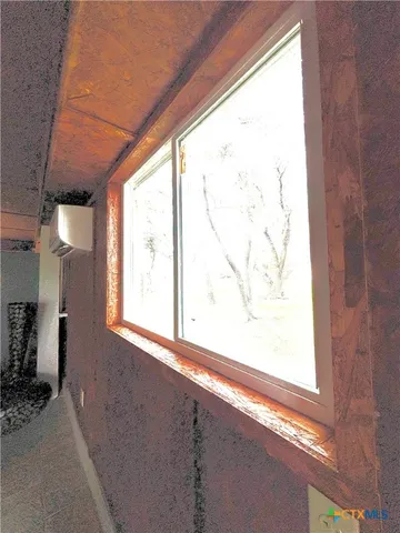 a room with furniture and musical instruments