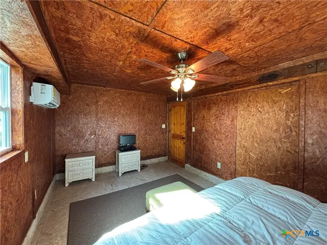 a view of a big yard with a table and a chairs