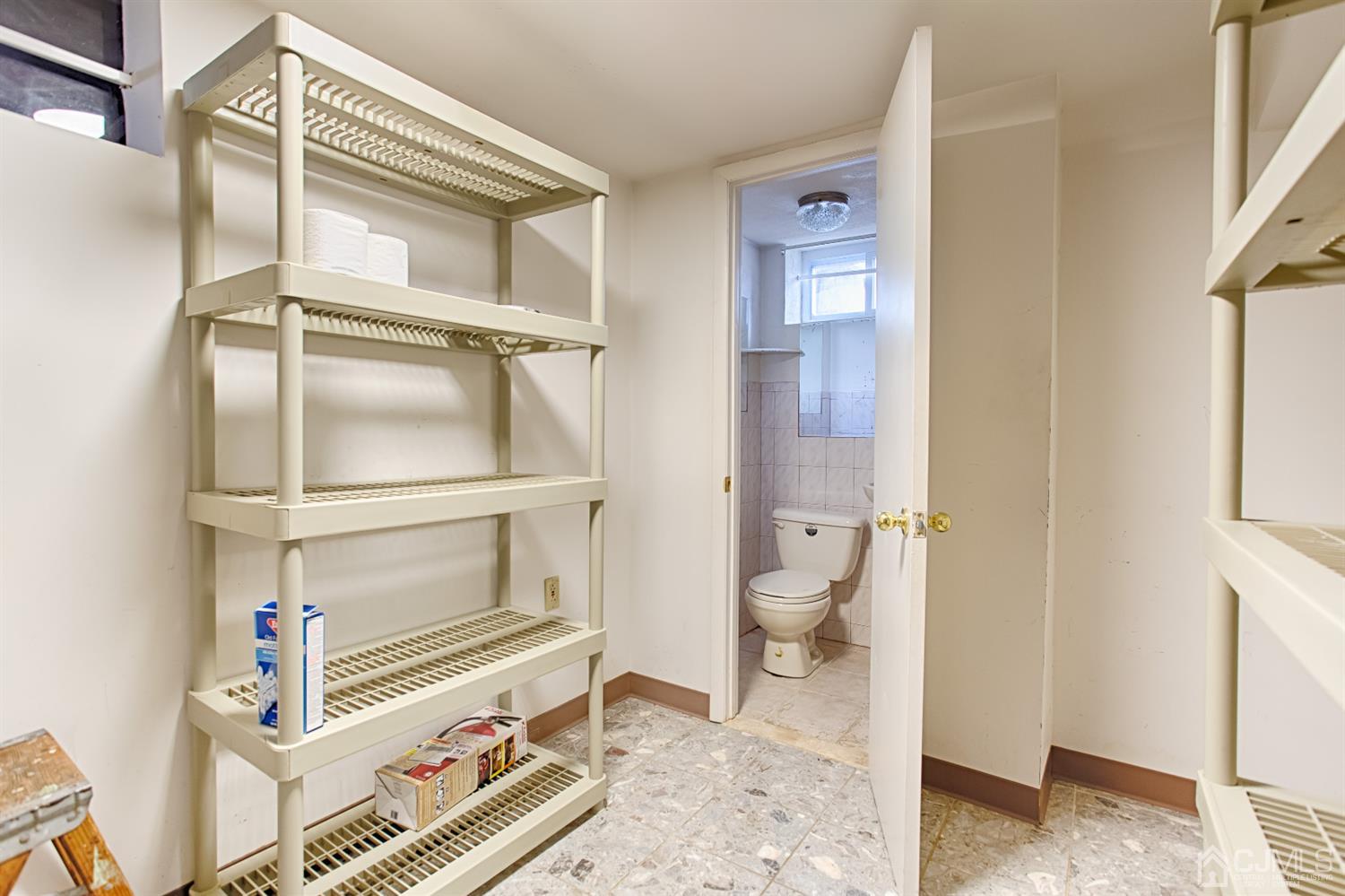 24 Longfield Road New Brunswick, NJ 08901 - Photo 22 of 27 a bathroom with a toilet and a shower