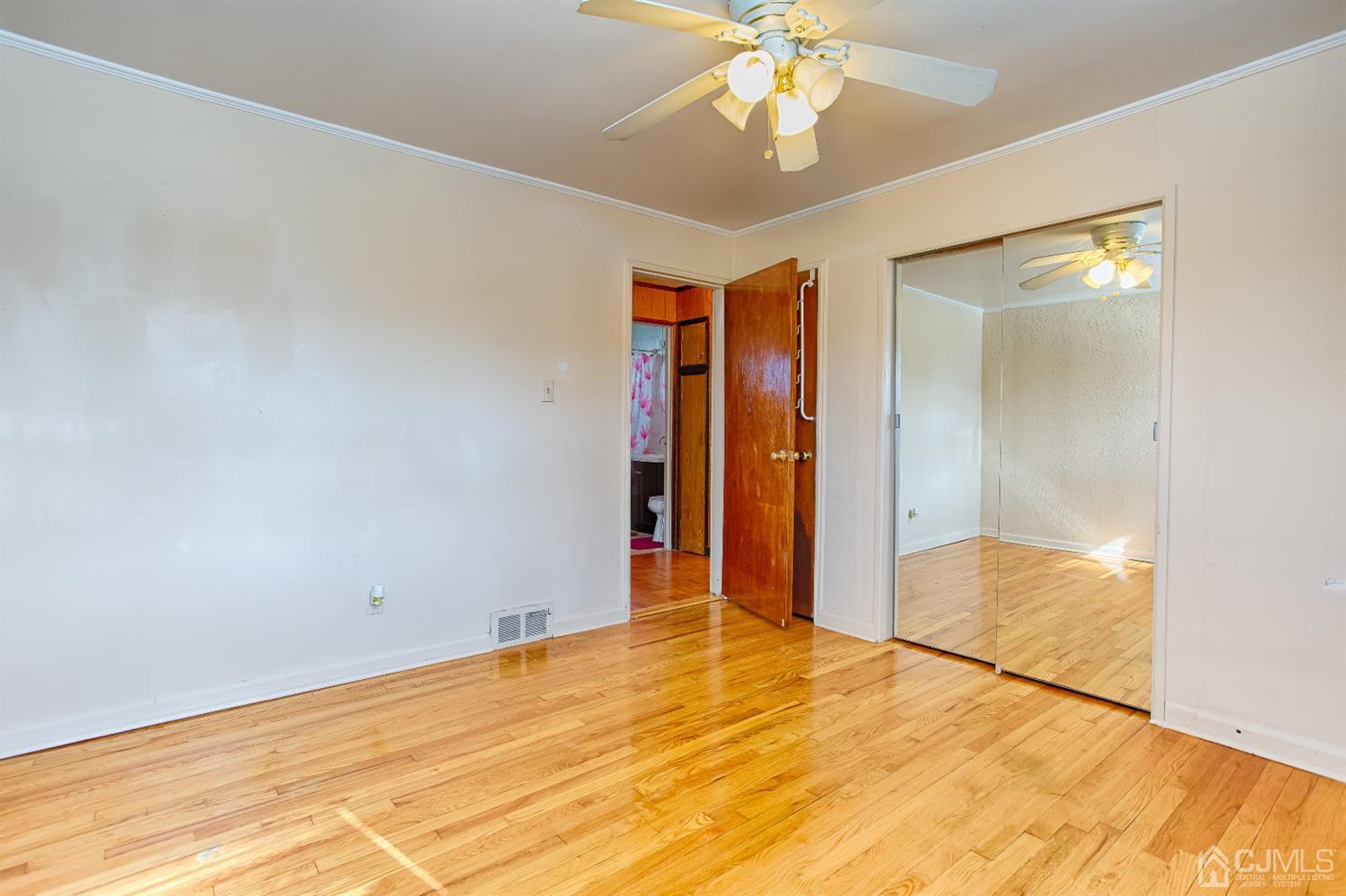 24 Longfield Road New Brunswick, NJ 08901 - Photo 10 of 27 a view of empty room with wooden floor