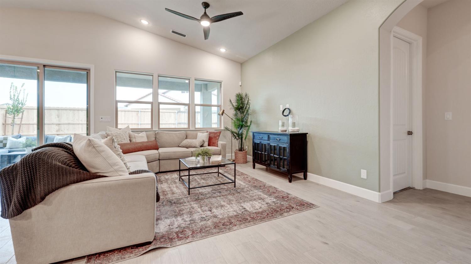 935 Talus Way Madera, CA 93636 - Photo 11 of 34 a living room with furniture and a fireplace