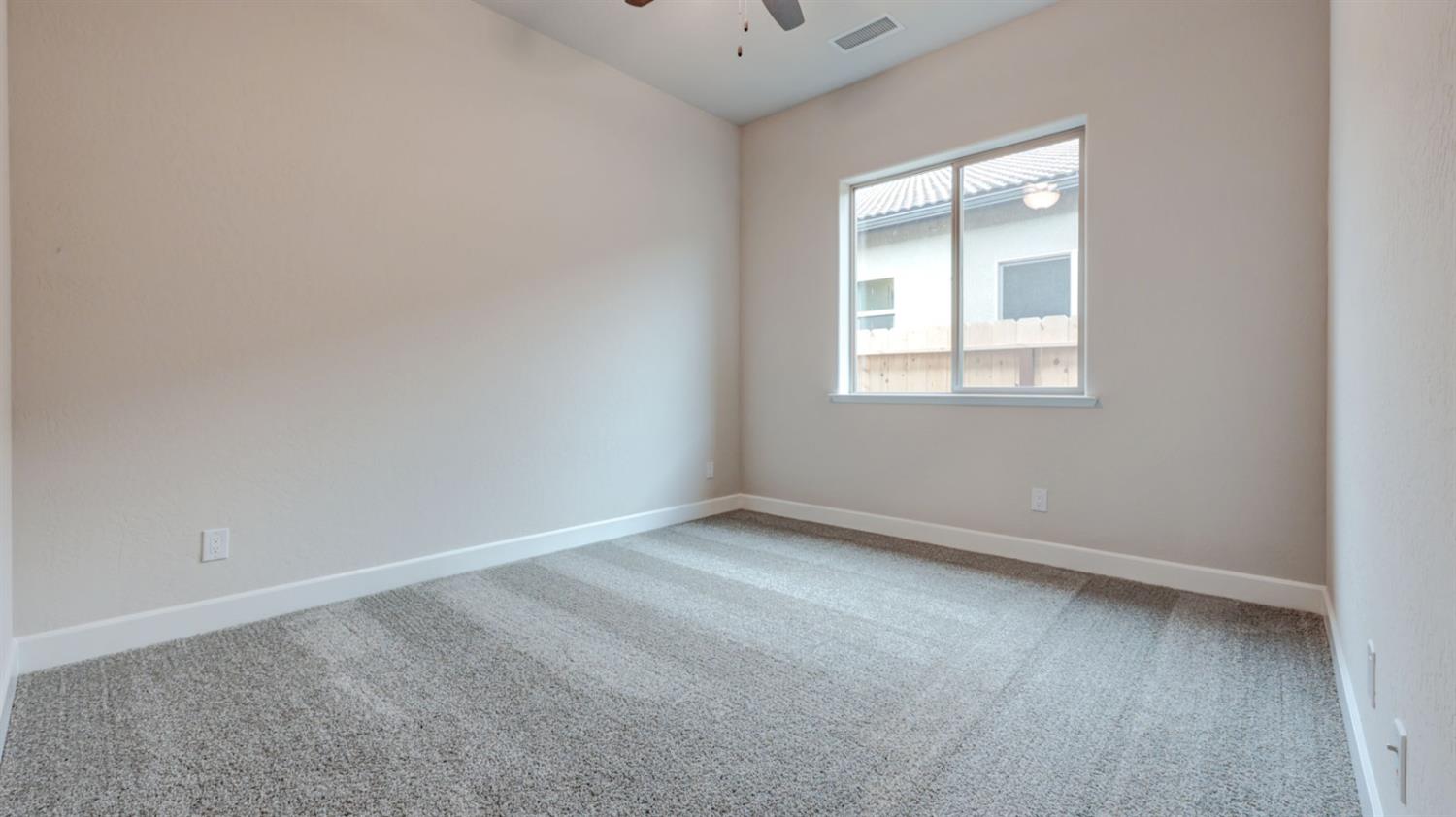 935 Talus Way Madera, CA 93636 - Photo 18 of 34 an empty room with a window