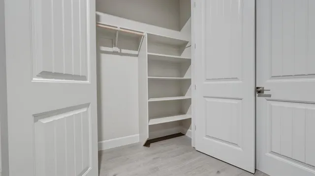 a view of an empty walk in closet