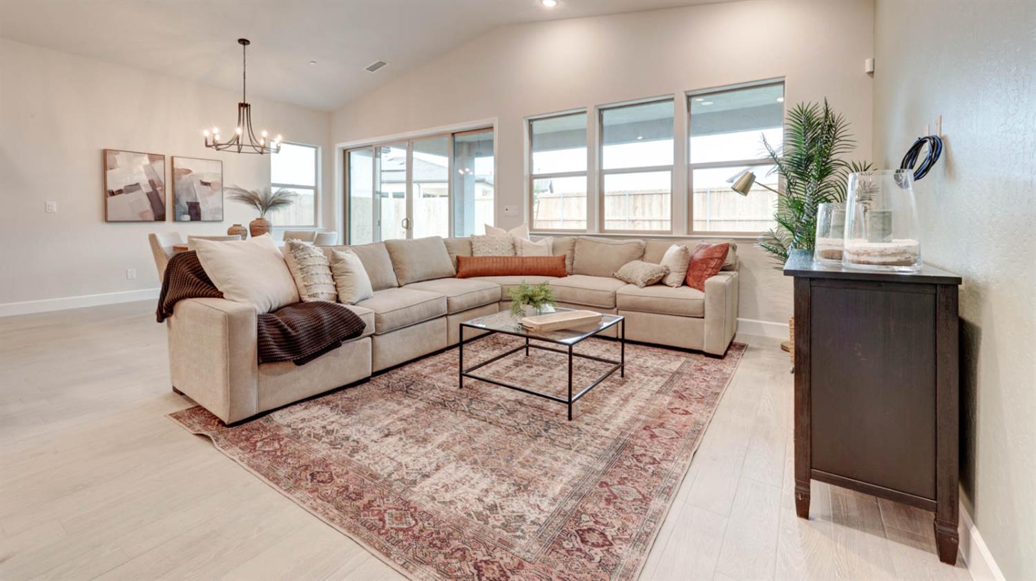 935 Talus Way Madera, CA 93636 - Photo 10 of 34 a living room with furniture and a large window