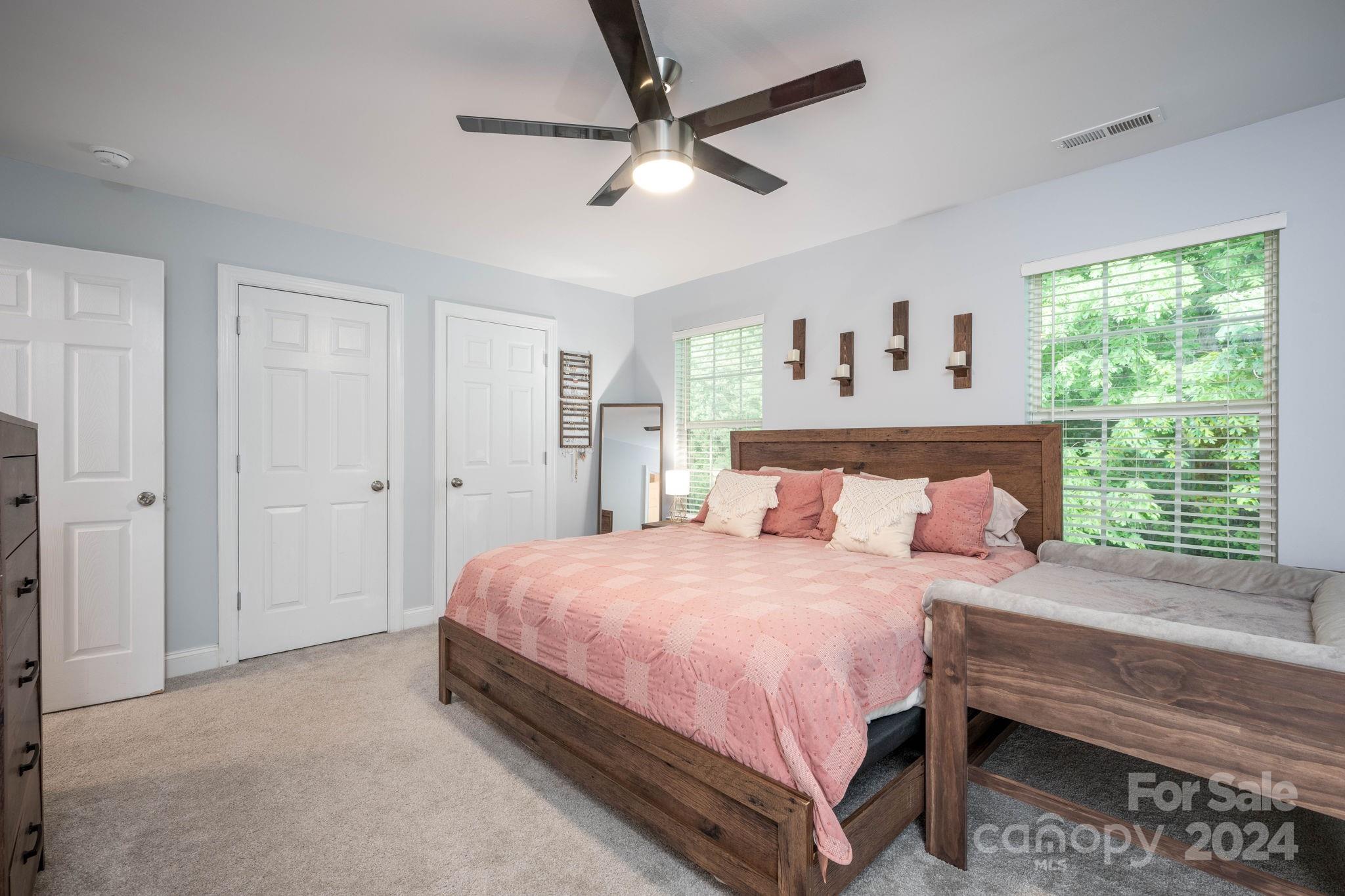 147 High Ridge Road Mooresville, NC 28117 - Photo 18 of 30 a bedroom with a bed and a large window