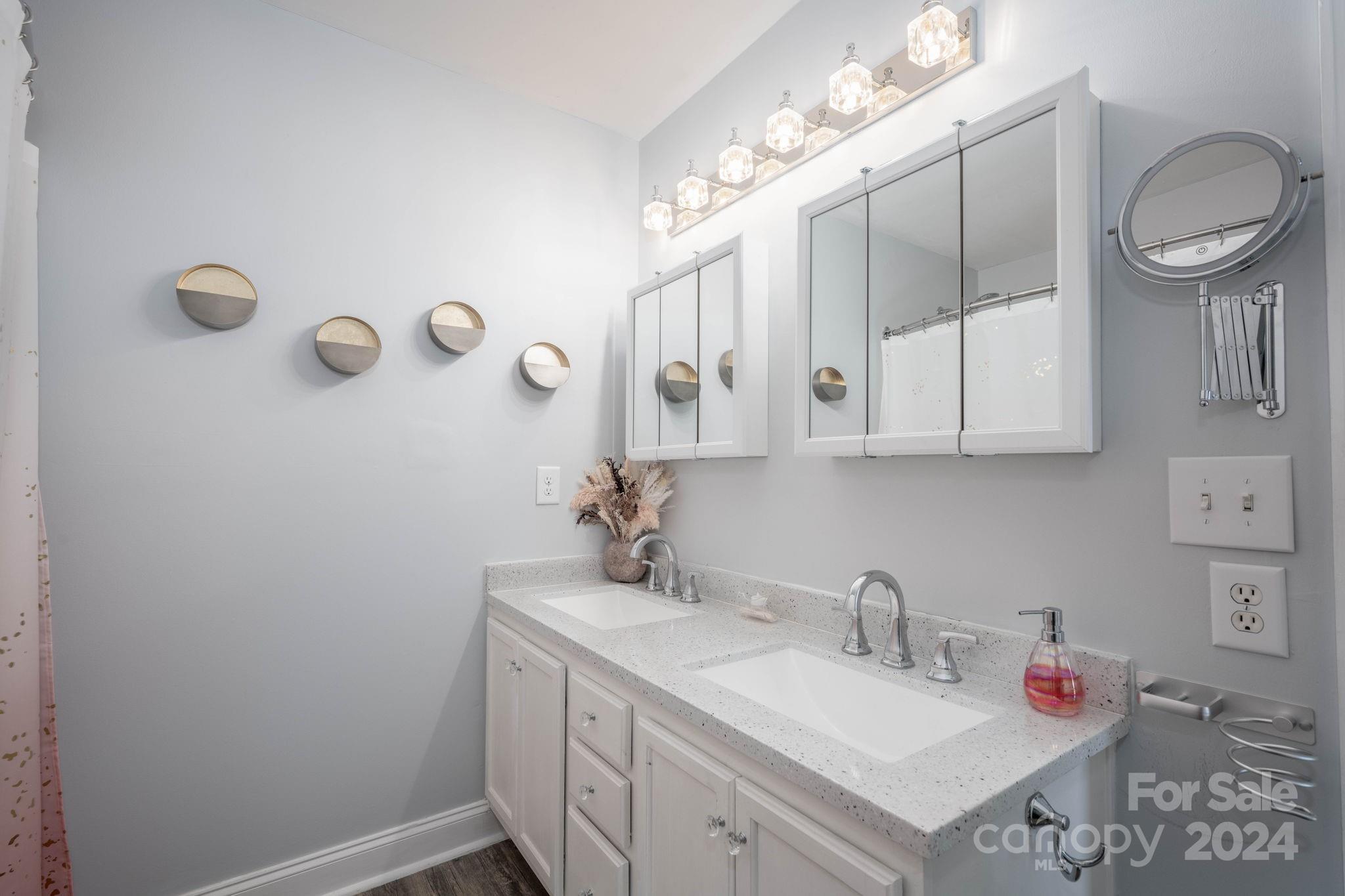 147 High Ridge Road Mooresville, NC 28117 - Photo 20 of 30 a bathroom with a sink vanity and mirror