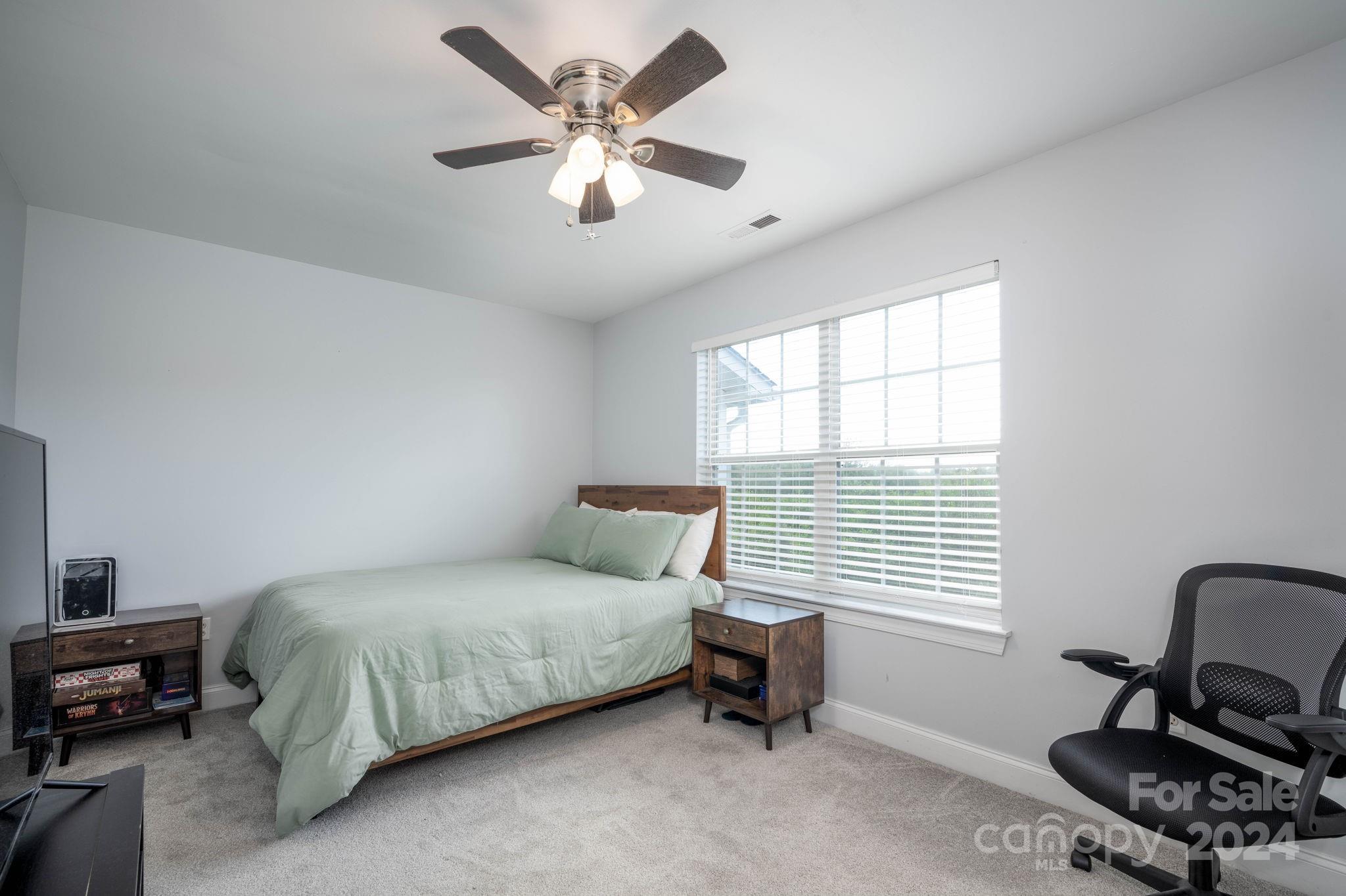 147 High Ridge Road Mooresville, NC 28117 - Photo 21 of 30 a bedroom with a bed furniture and a window