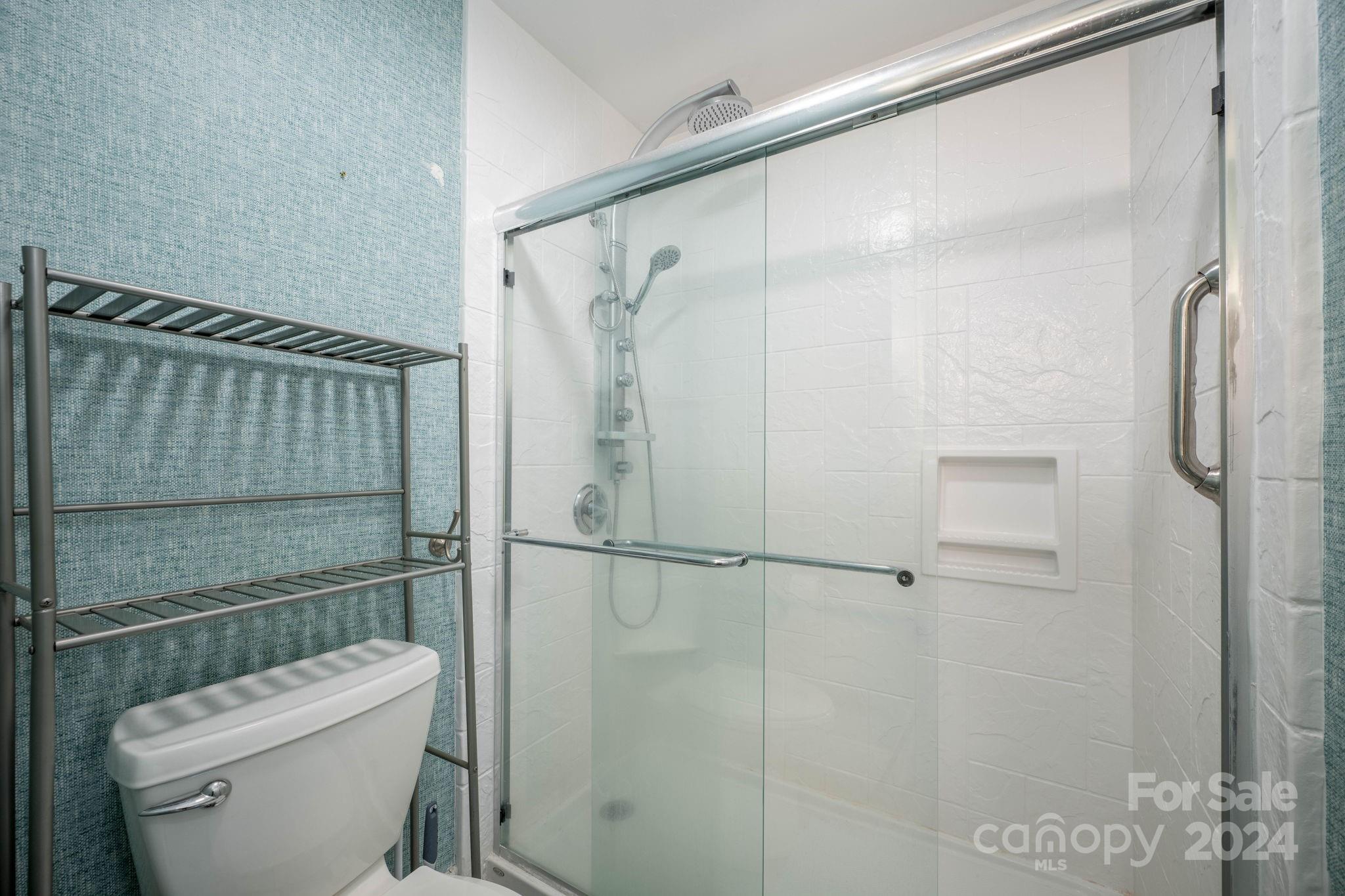 147 High Ridge Road Mooresville, NC 28117 - Photo 25 of 30 a bathroom with a toilet and a shower