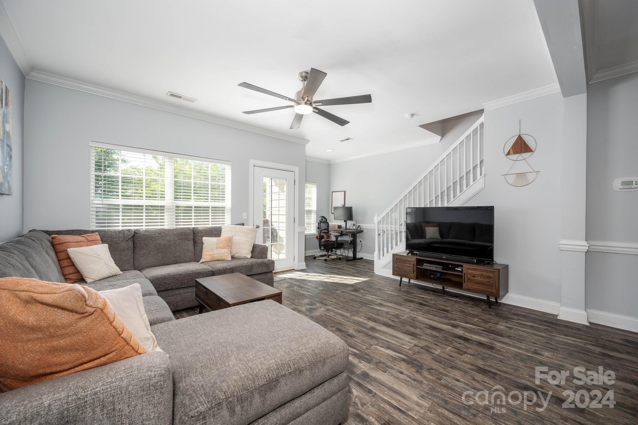 147 High Ridge Road Mooresville, NC 28117 - Photo 5 of 30 a living room with furniture a window and a flat screen tv