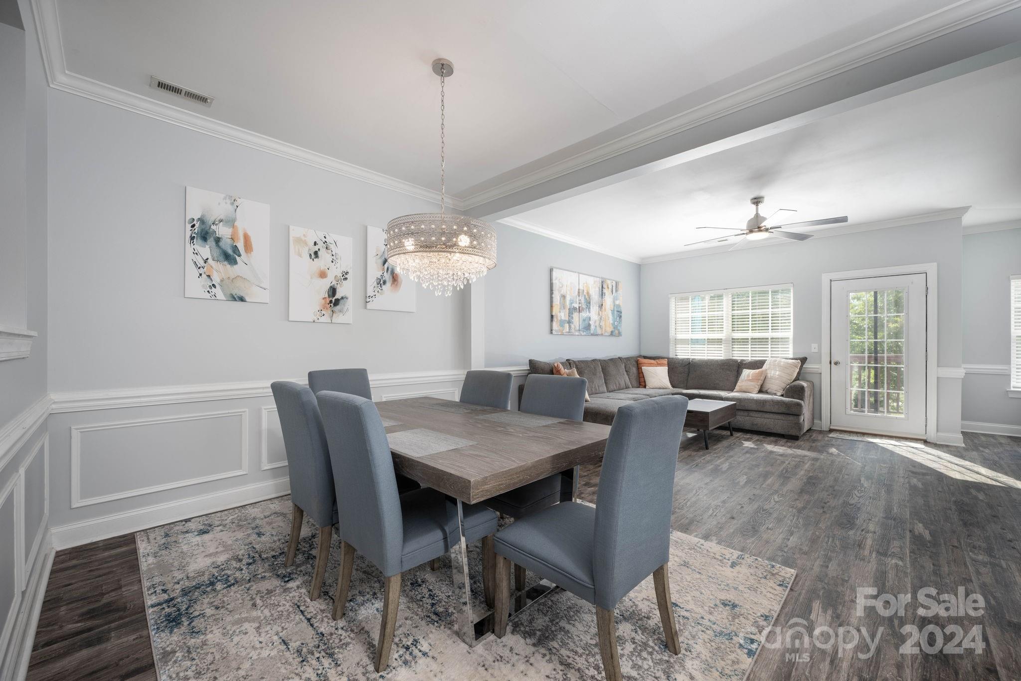 147 High Ridge Road Mooresville, NC 28117 - Photo 10 of 30 a view of a dining room with furniture window and wooden floor