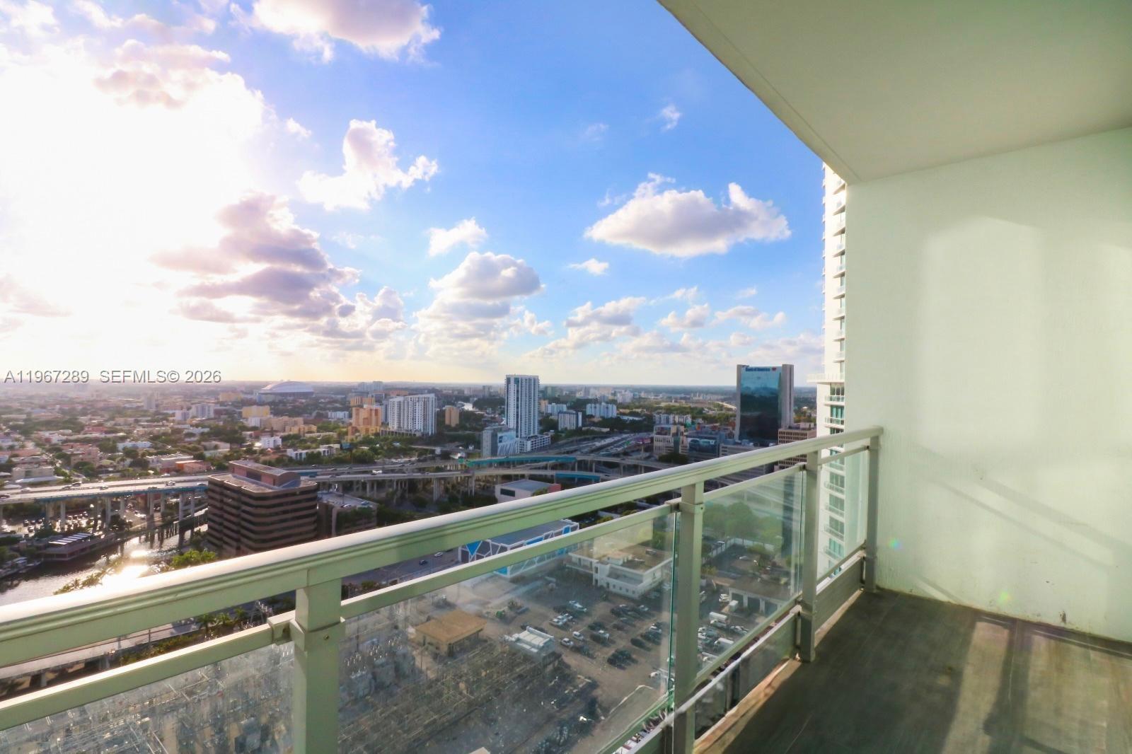 92 Southwest 3rd Street, Unit 2706 Miami, FL 33130 - Photo 7 of 13 a view of city from a balcony