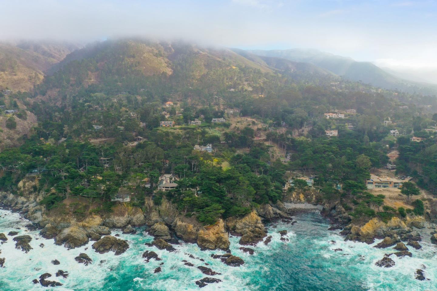 161 Spindrift Road, Unit B Carmel, CA 93923 - Photo 2 of 22 a view of a forest with a street