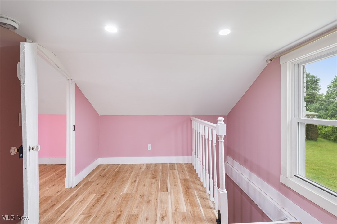 1853 Sylvan Road Wooster, OH 44691 - Photo 22 of 37 Bedroom with light wood-style flooring, vaulted ceiling, and recessed lighting