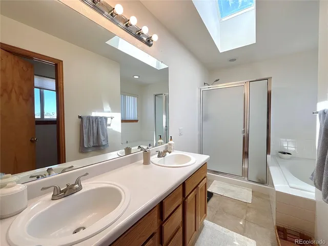 a bathroom with a sink double vanity and a mirror