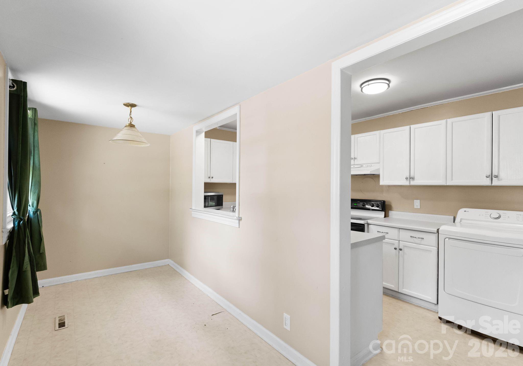 1136 East Woodlawn Road Charlotte, NC 28209 - Photo 13 of 47 a view of a kitchen with a sink