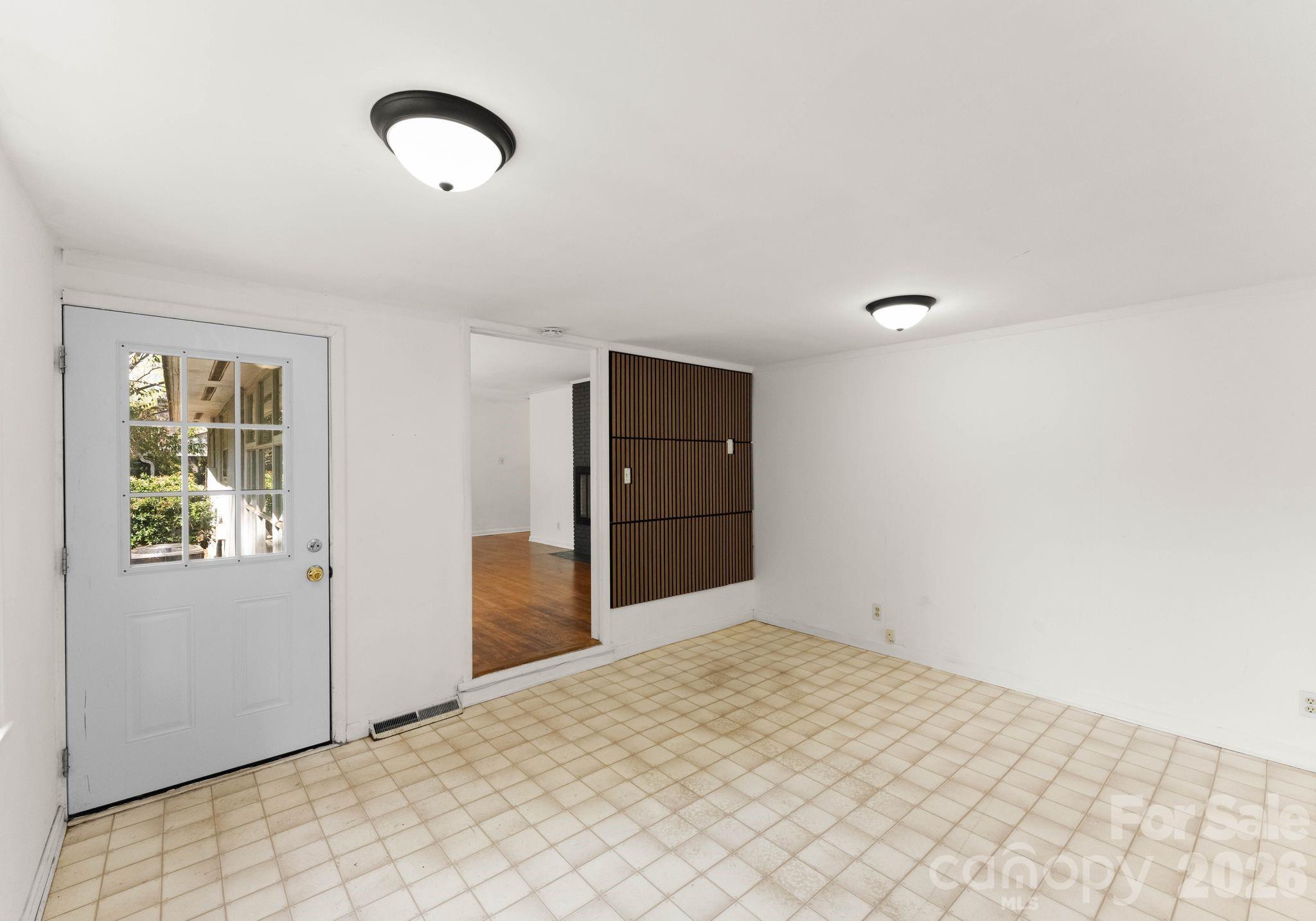 1136 East Woodlawn Road Charlotte, NC 28209 - Photo 26 of 47 a view of a livingroom with wooden floor and a window
