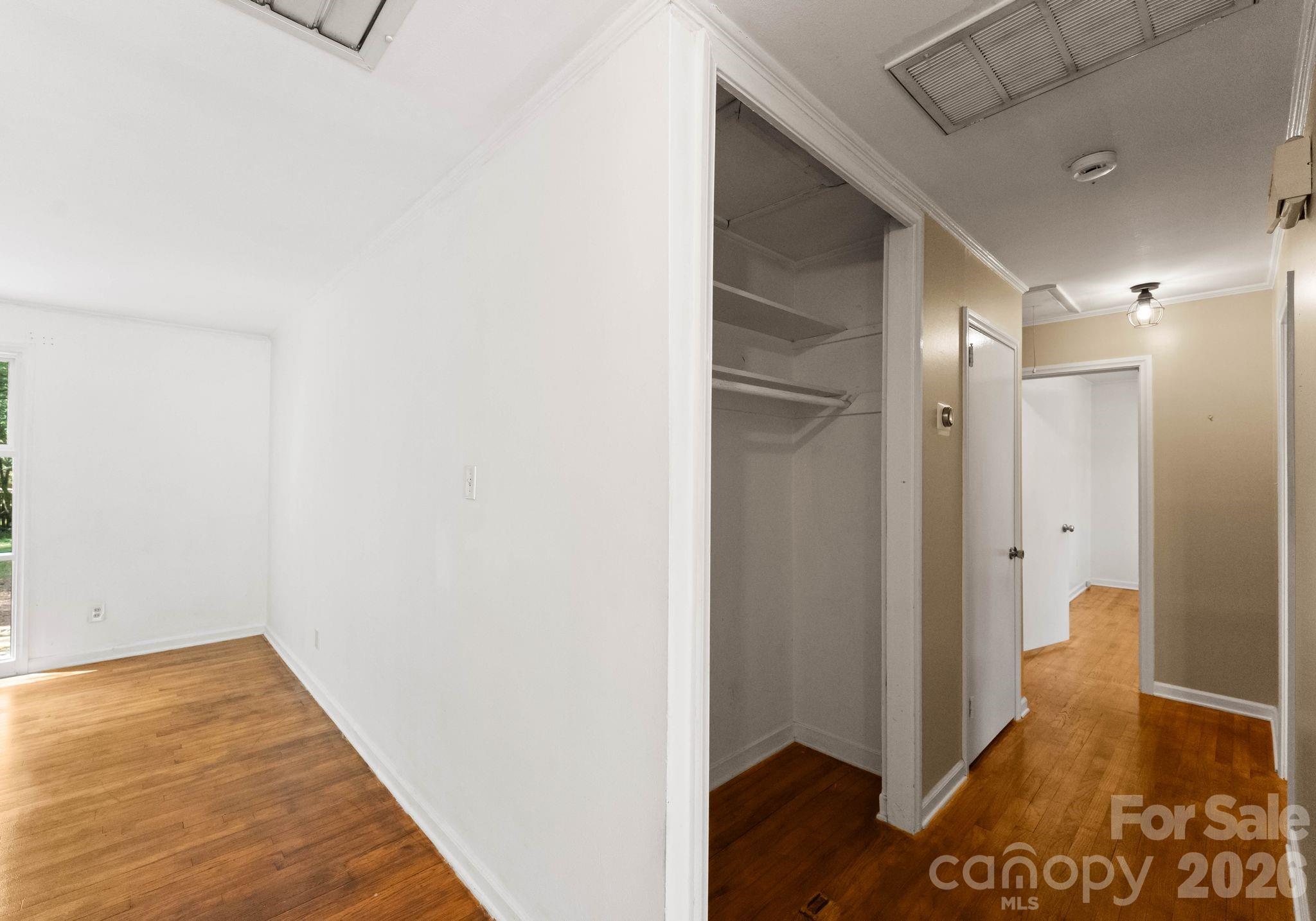 1136 East Woodlawn Road Charlotte, NC 28209 - Photo 36 of 47 a view of a hallway with wooden floor