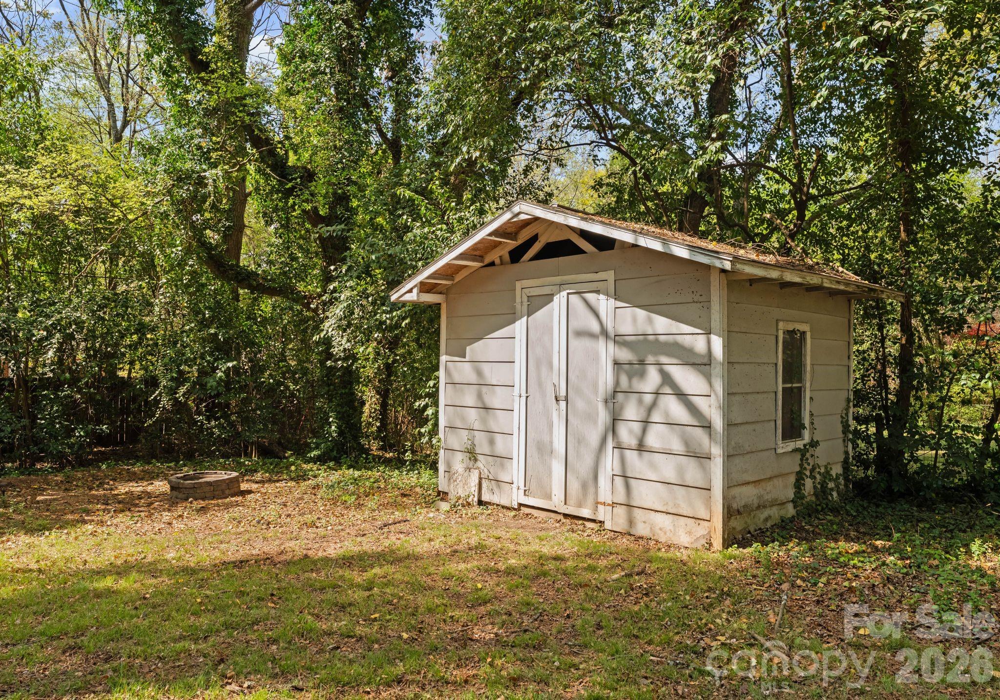 1136 East Woodlawn Road Charlotte, NC 28209 - Photo 40 of 47 a front view of a house with a yard