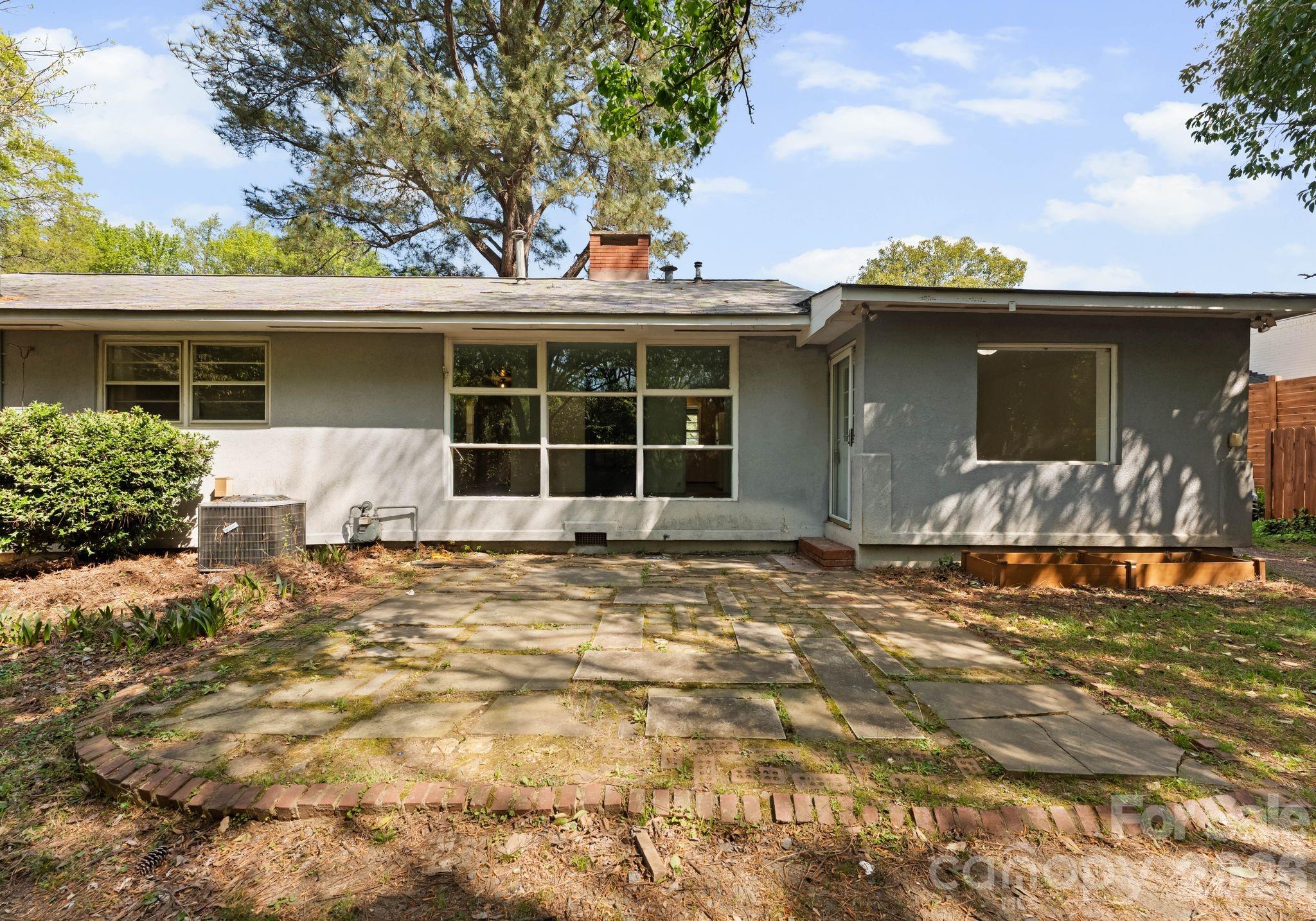 1136 East Woodlawn Road Charlotte, NC 28209 - Photo 42 of 47 front view of a house with a yard
