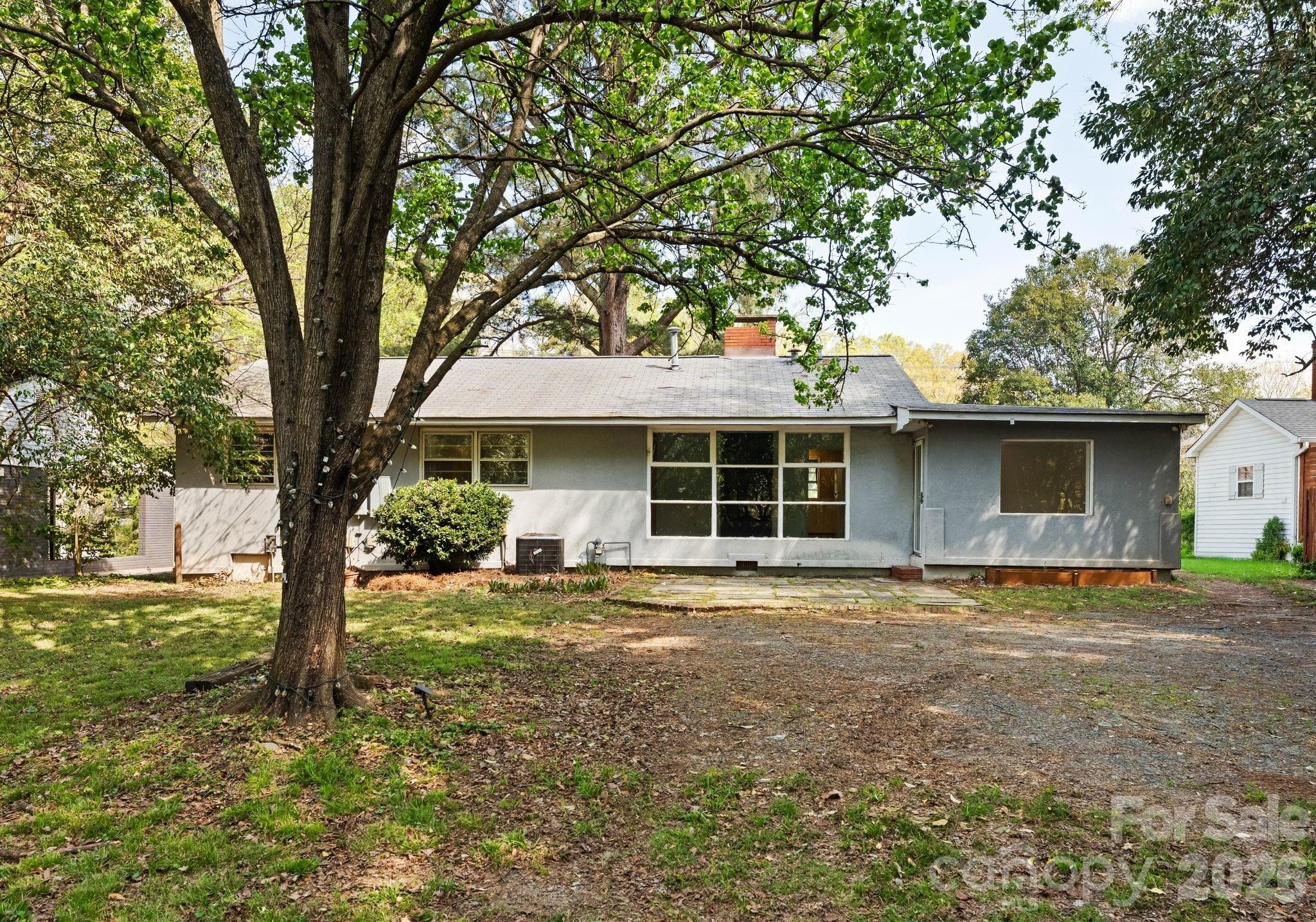 1136 East Woodlawn Road Charlotte, NC 28209 - Photo 44 of 47 a front view of a house with a garden