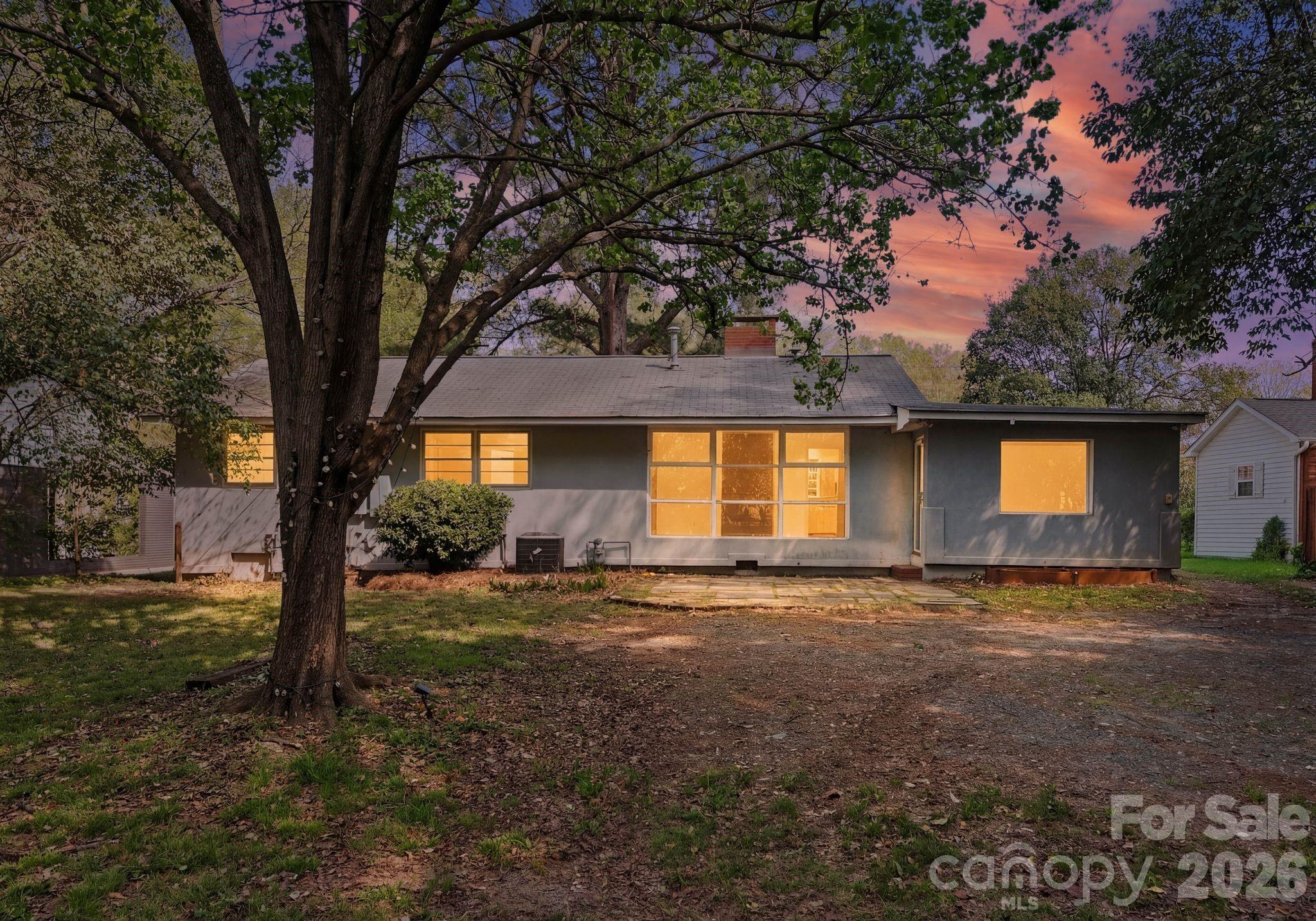 1136 East Woodlawn Road Charlotte, NC 28209 - Photo 45 of 47 a view of a house with a yard