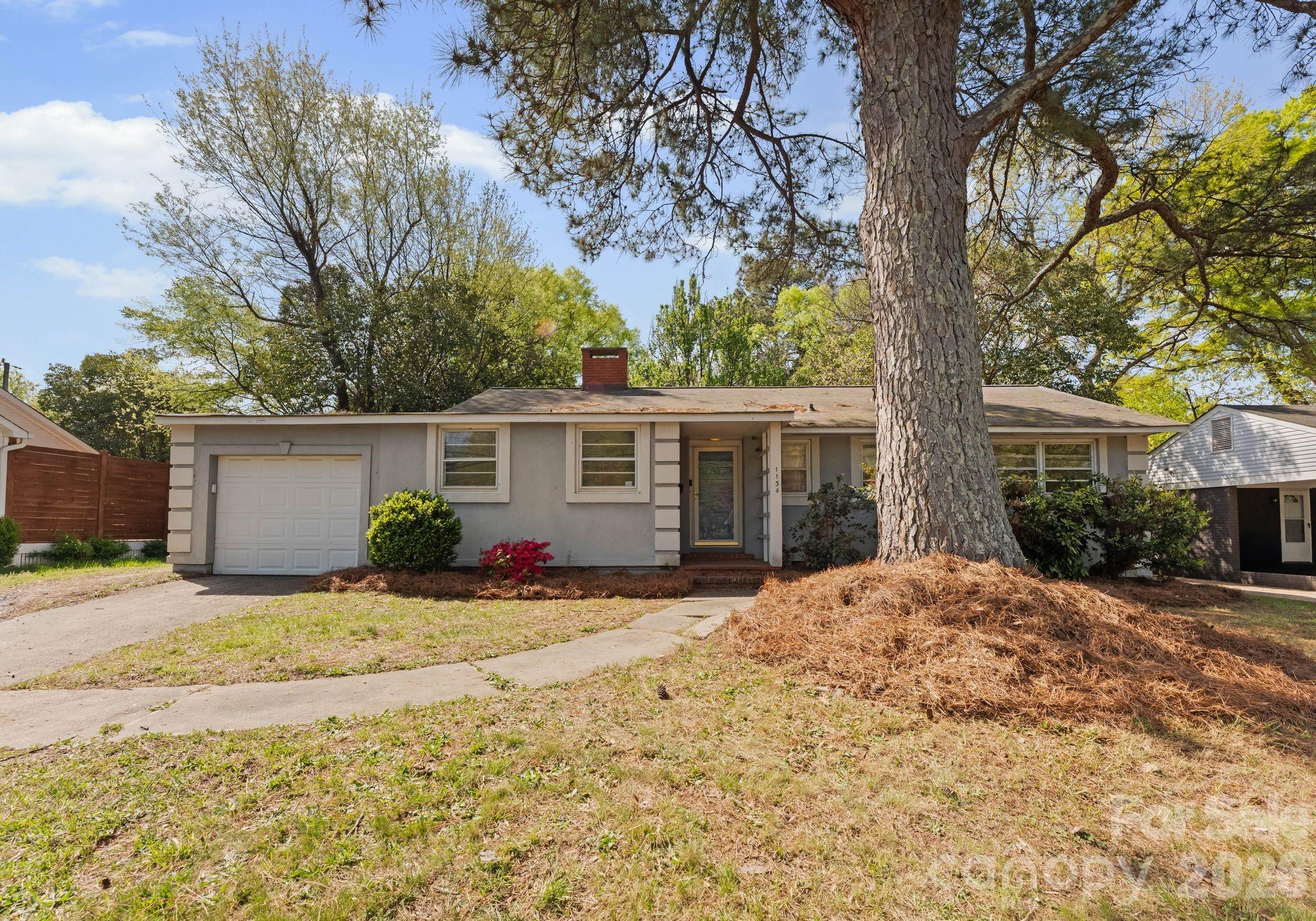 1136 East Woodlawn Road Charlotte, NC 28209 - Photo 47 of 47 a view of a house with a yard covered in snow