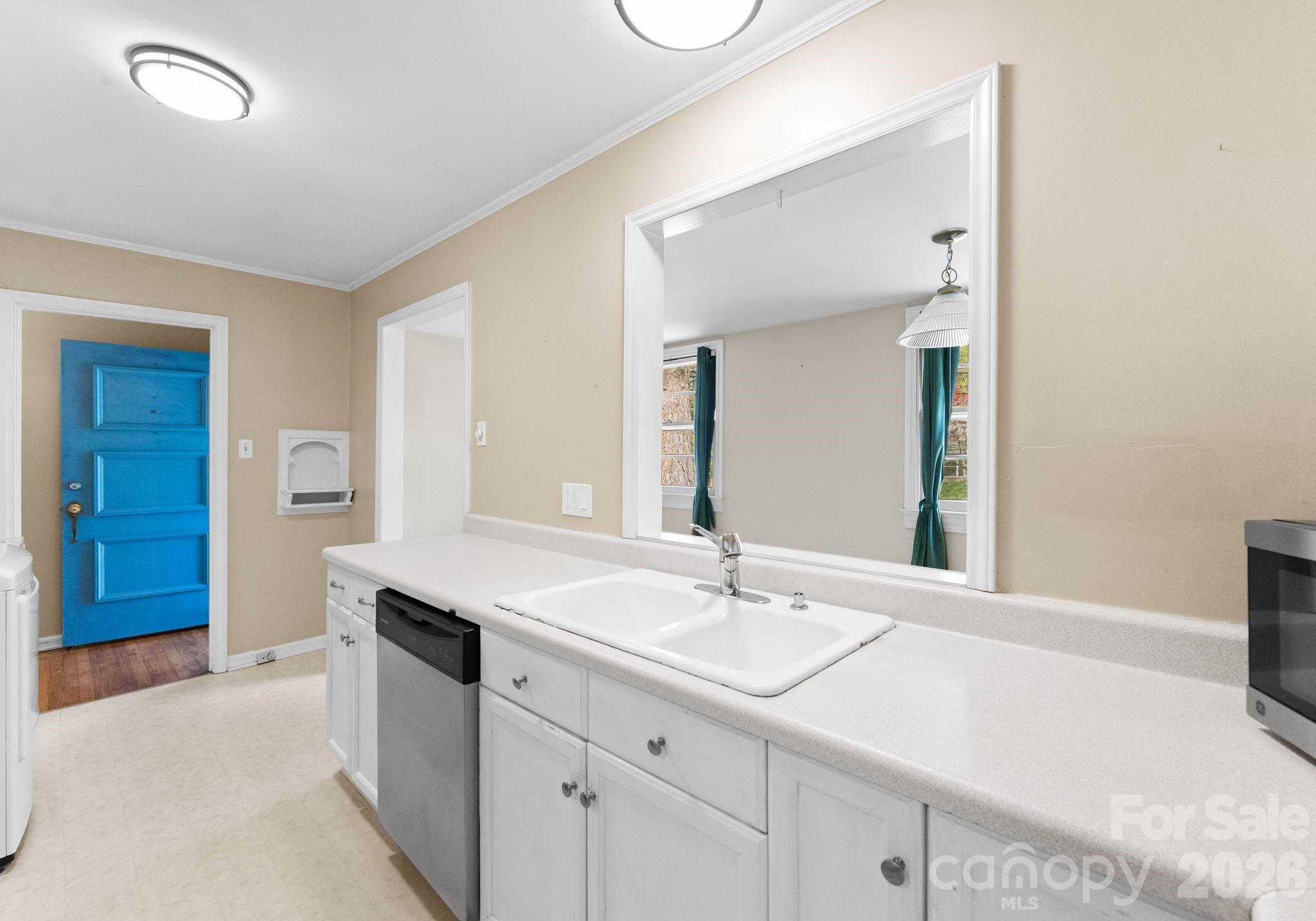 1136 East Woodlawn Road Charlotte, NC 28209 - Photo 9 of 47 a bathroom with a sink and a mirror