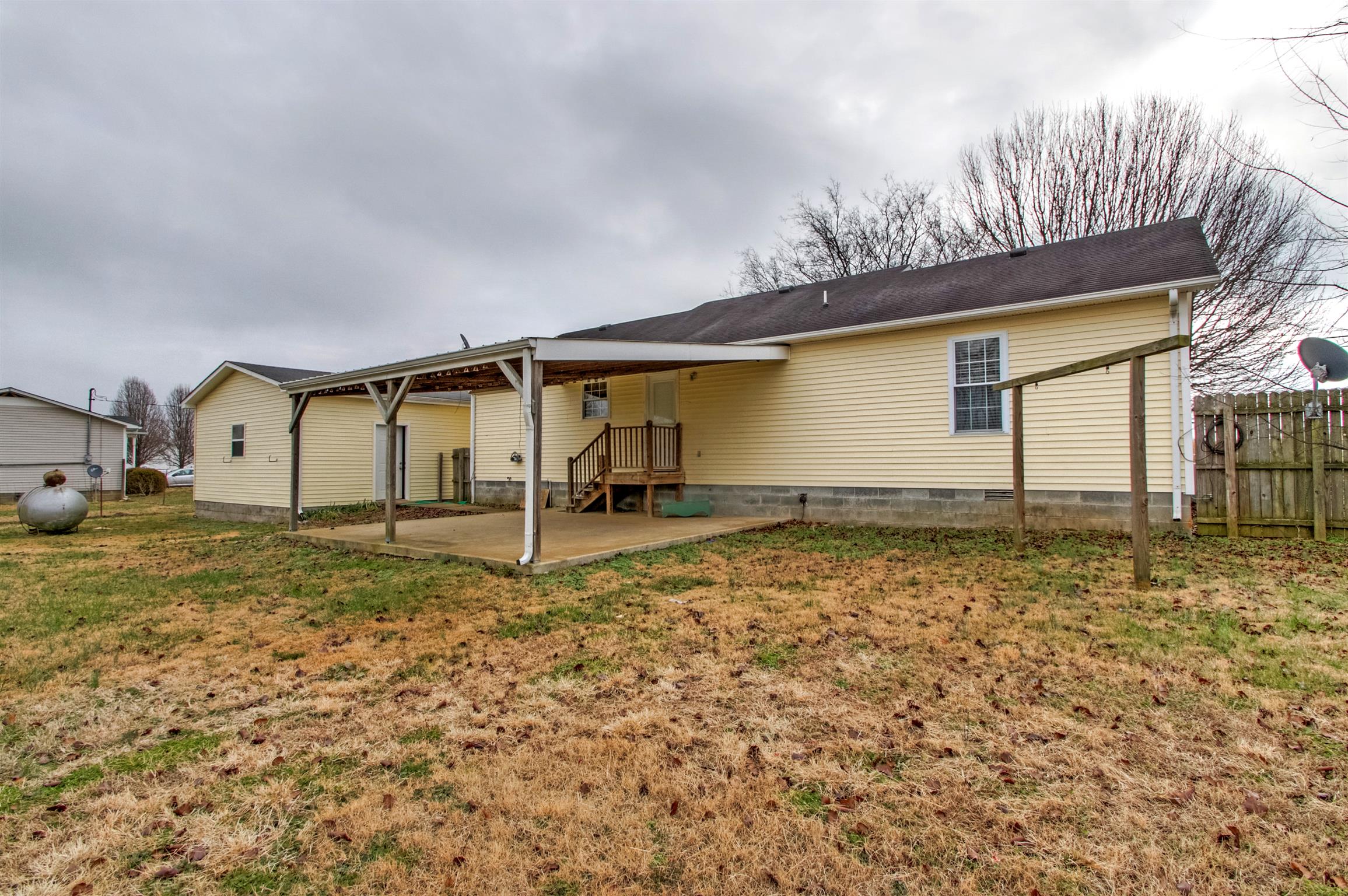 1533 Longview Road Unionville, TN 37180 - Photo 3 of 16 Large fenced backyard with covered patio
