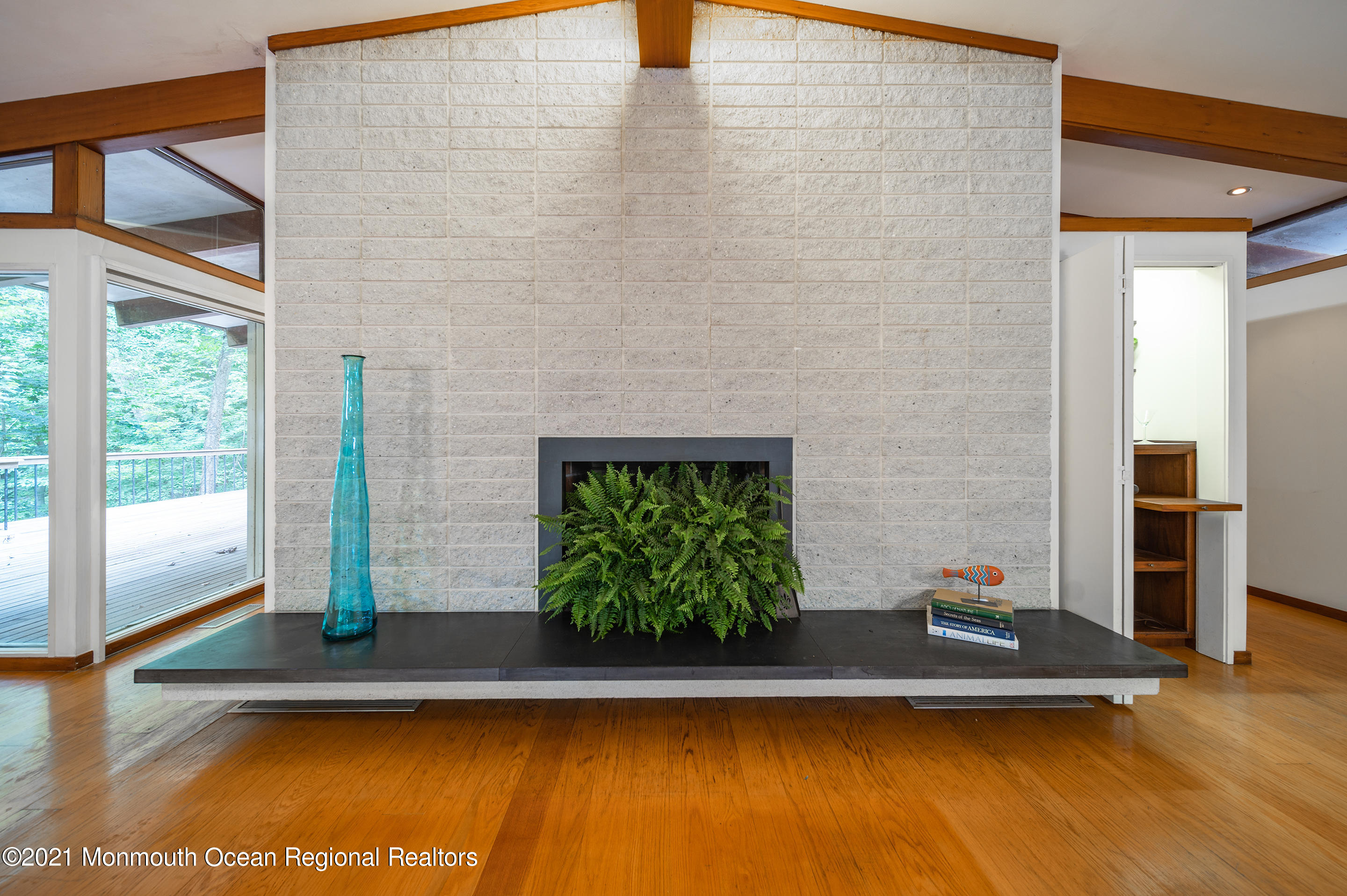277 Mc Clees Road Red Bank, NJ 07701 - Photo 12 of 53 a view of a living room with floor to ceiling window and wooden floor