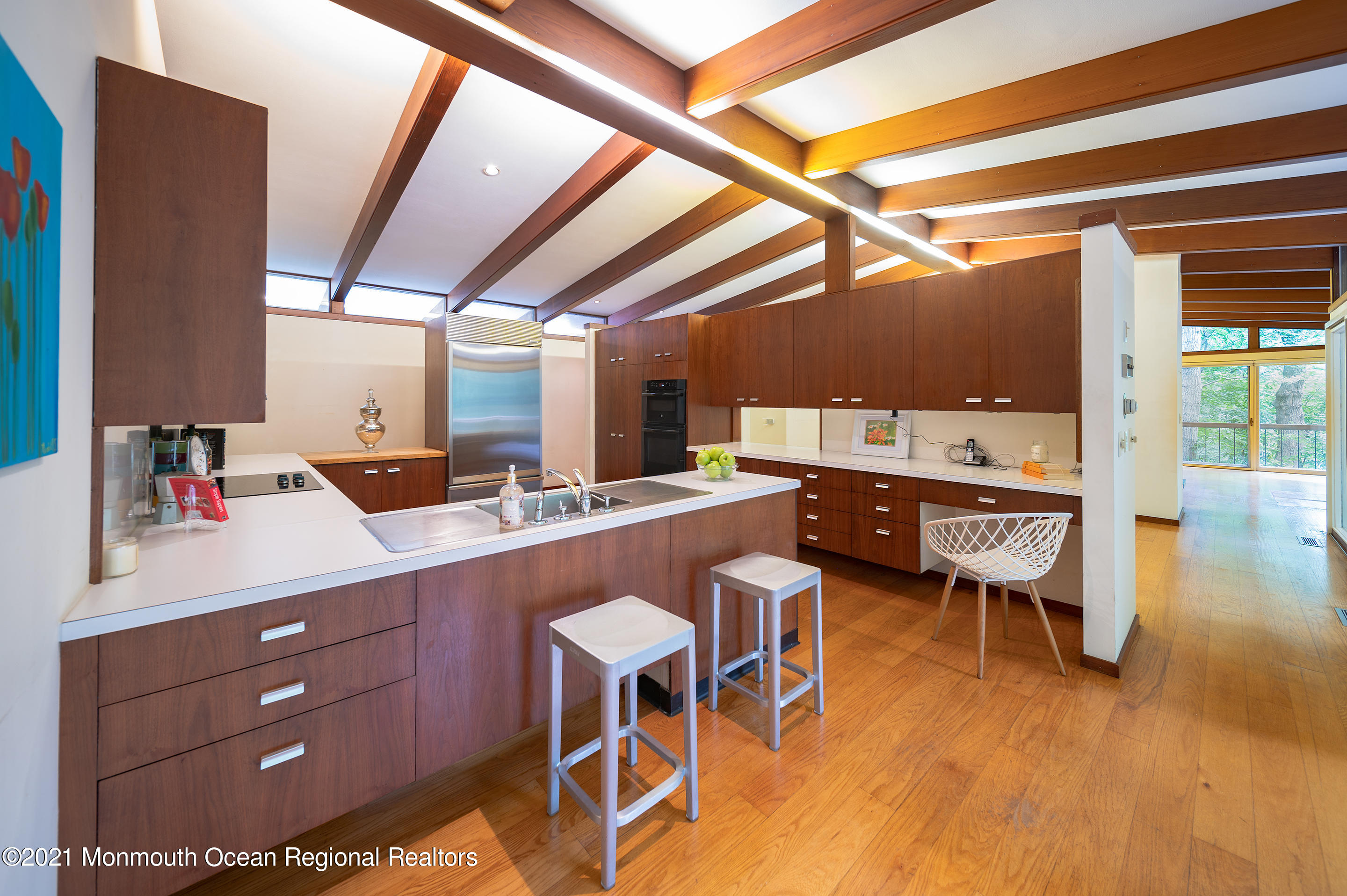 277 Mc Clees Road Red Bank, NJ 07701 - Photo 16 of 53 a room with stainless steel appliances kitchen island granite countertop furniture and a wooden floor