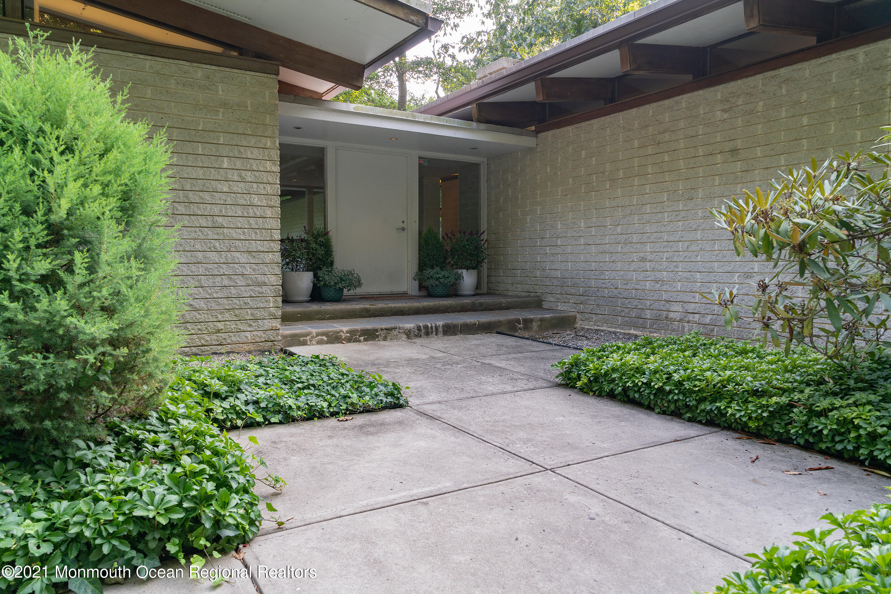 277 Mc Clees Road Red Bank, NJ 07701 - Photo 3 of 53 a front view of a house with garden