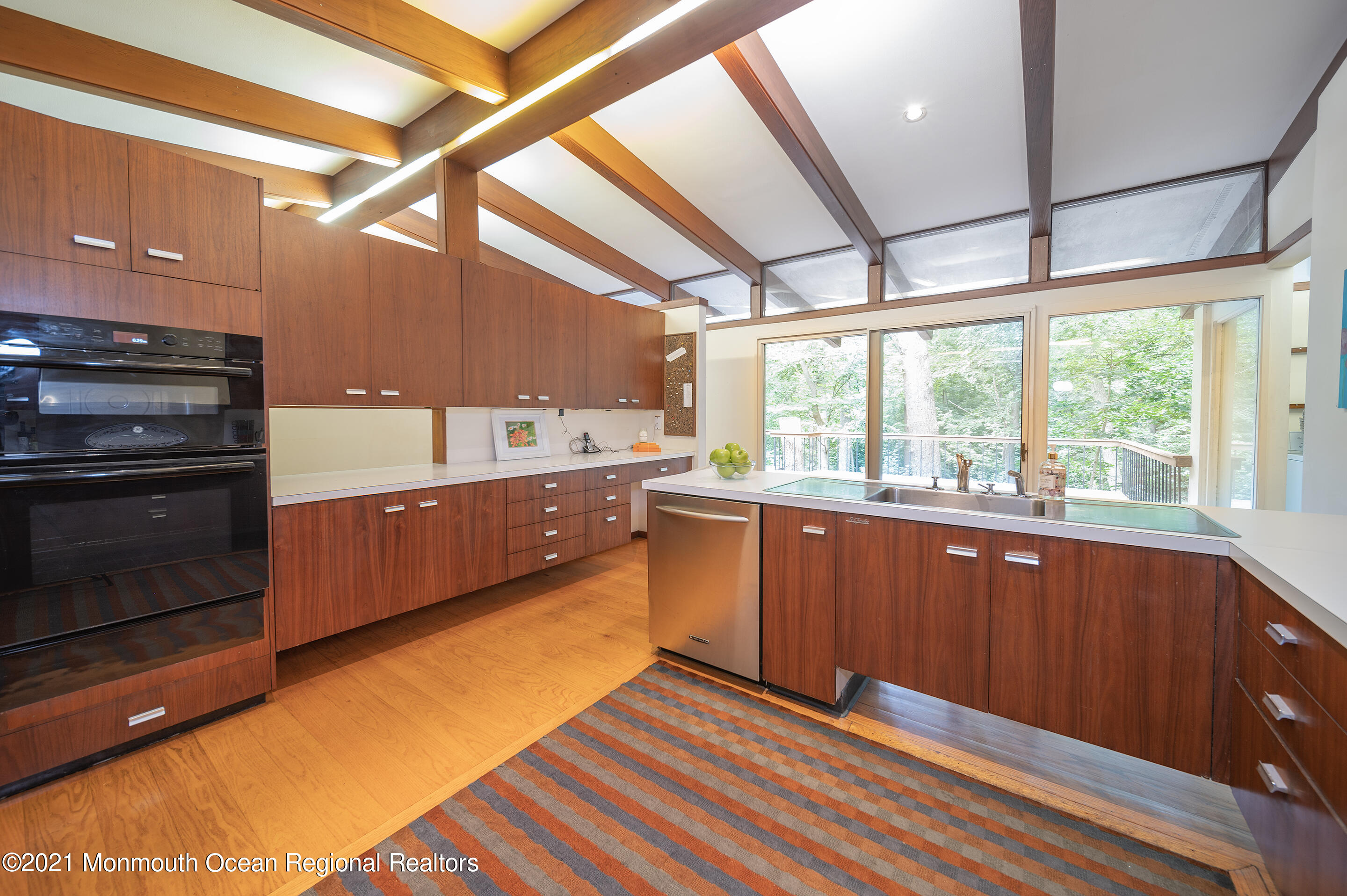 277 Mc Clees Road Red Bank, NJ 07701 - Photo 21 of 53 a kitchen with stainless steel appliances granite countertop a stove a sink and a microwave