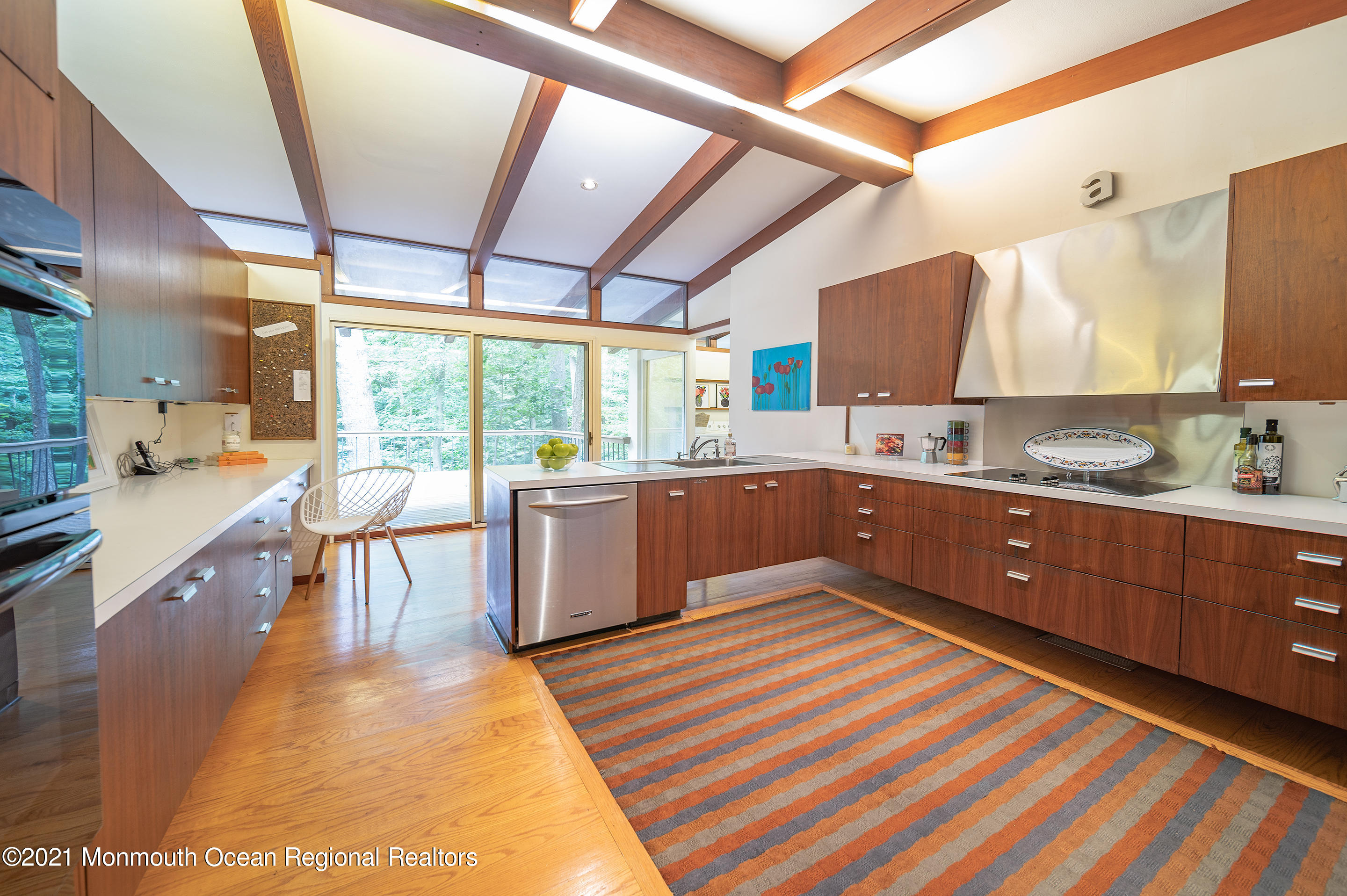 277 Mc Clees Road Red Bank, NJ 07701 - Photo 22 of 53 a kitchen with a sink a counter top space and stainless steel appliances