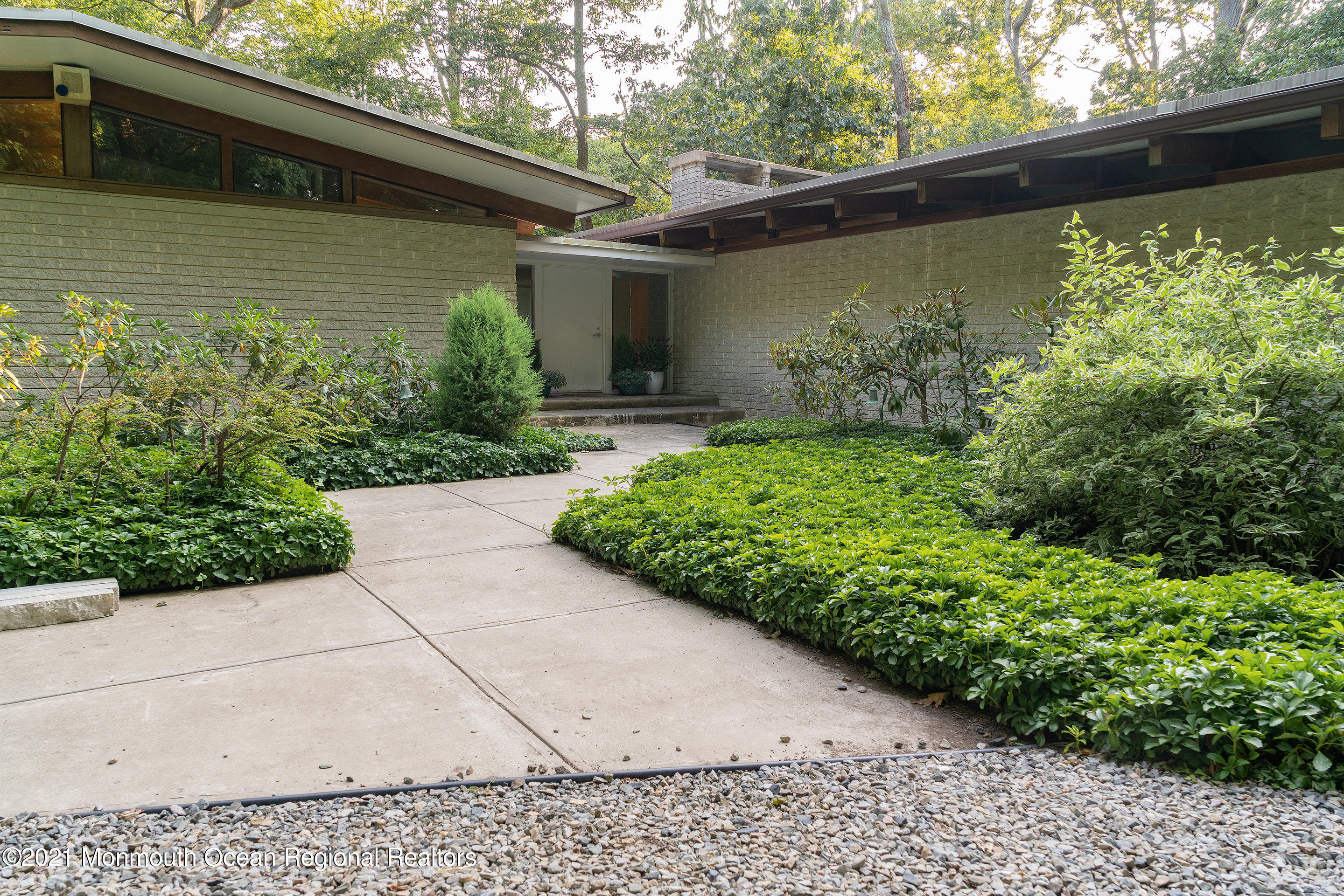 277 Mc Clees Road Red Bank, NJ 07701 - Photo 4 of 53 a front view of a house with garden