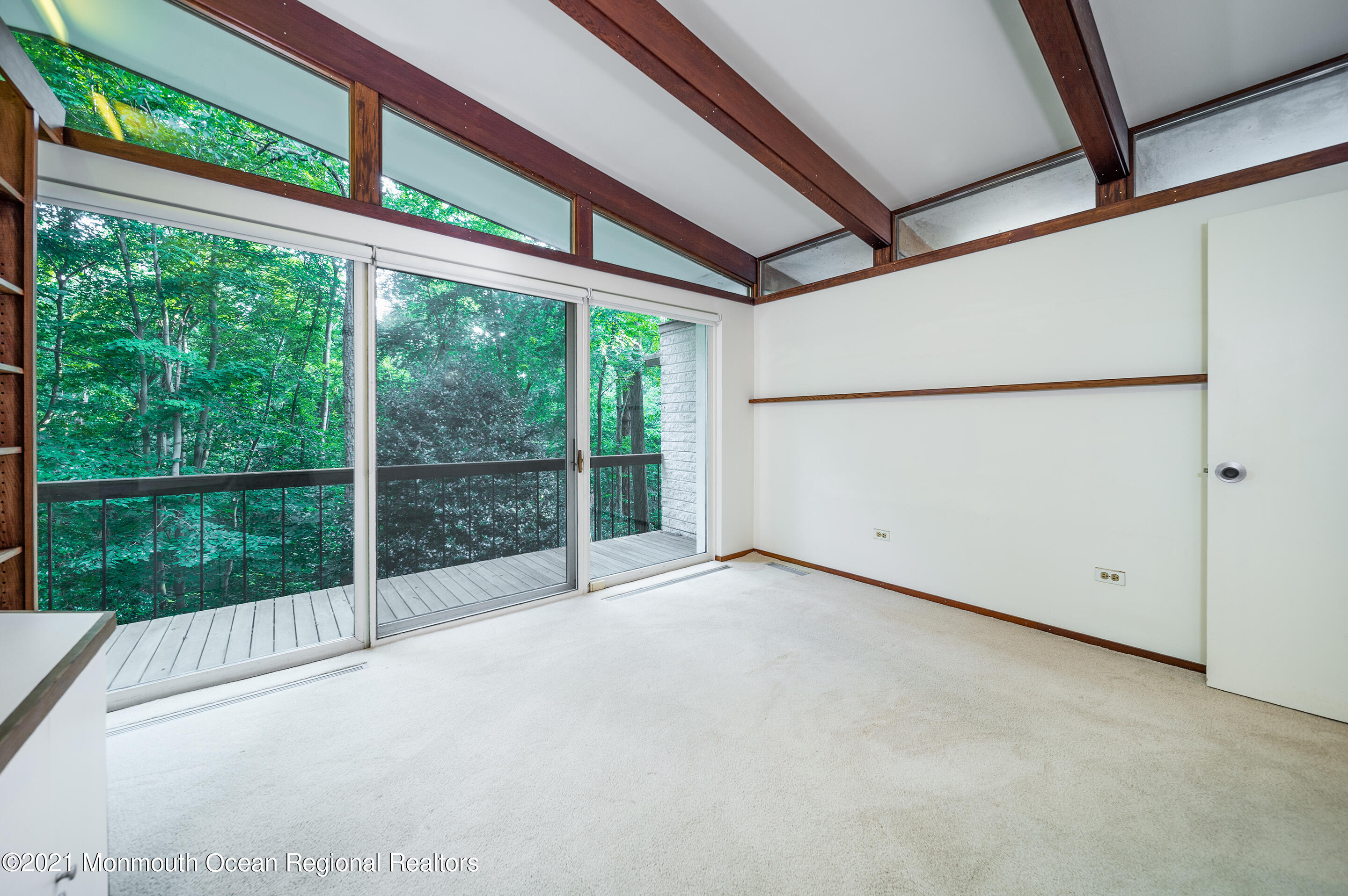 277 Mc Clees Road Red Bank, NJ 07701 - Photo 32 of 53 a view of an empty room with a balcony