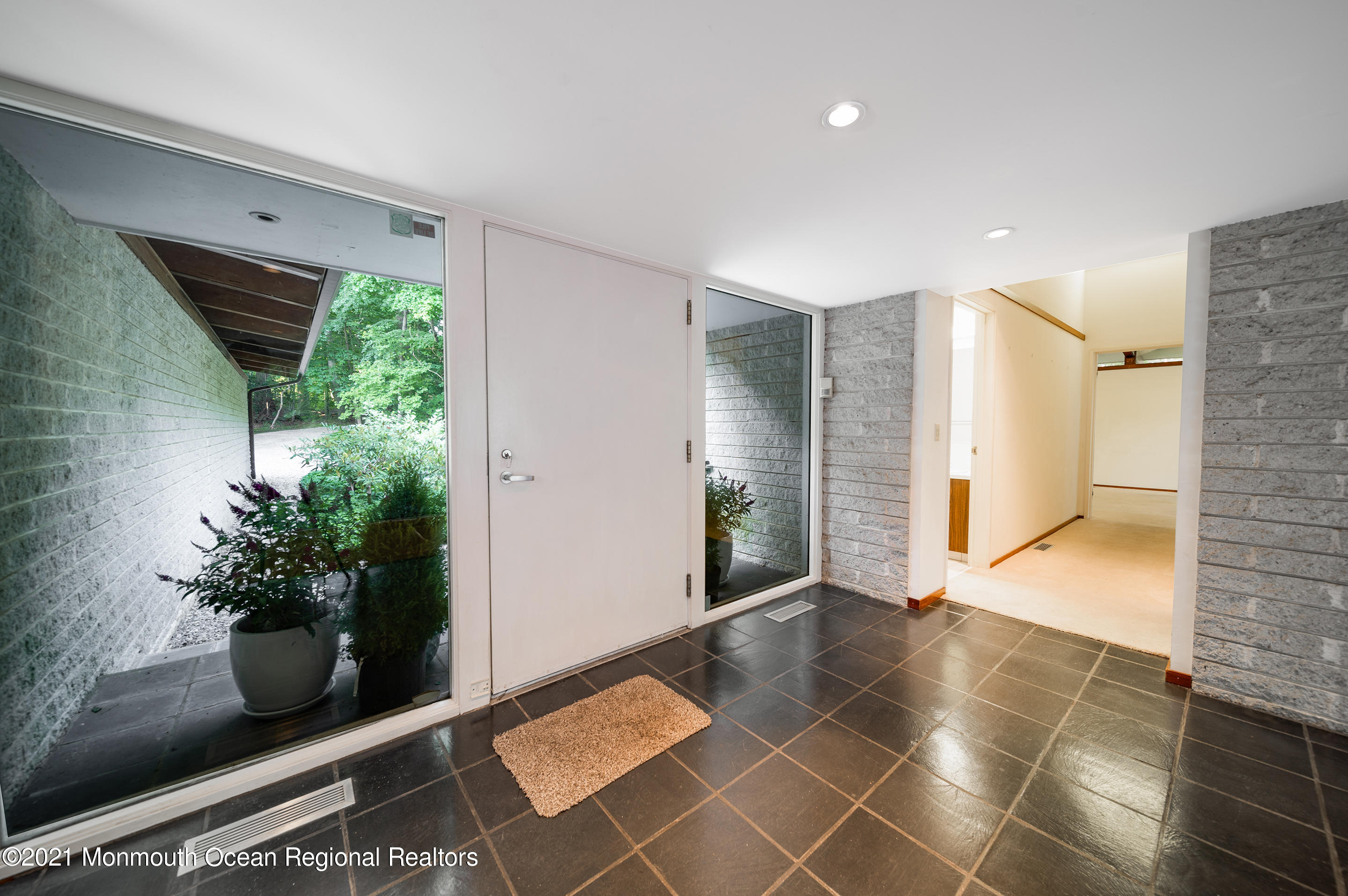 277 Mc Clees Road Red Bank, NJ 07701 - Photo 34 of 53 a hallway with wooden floor and a potted plant
