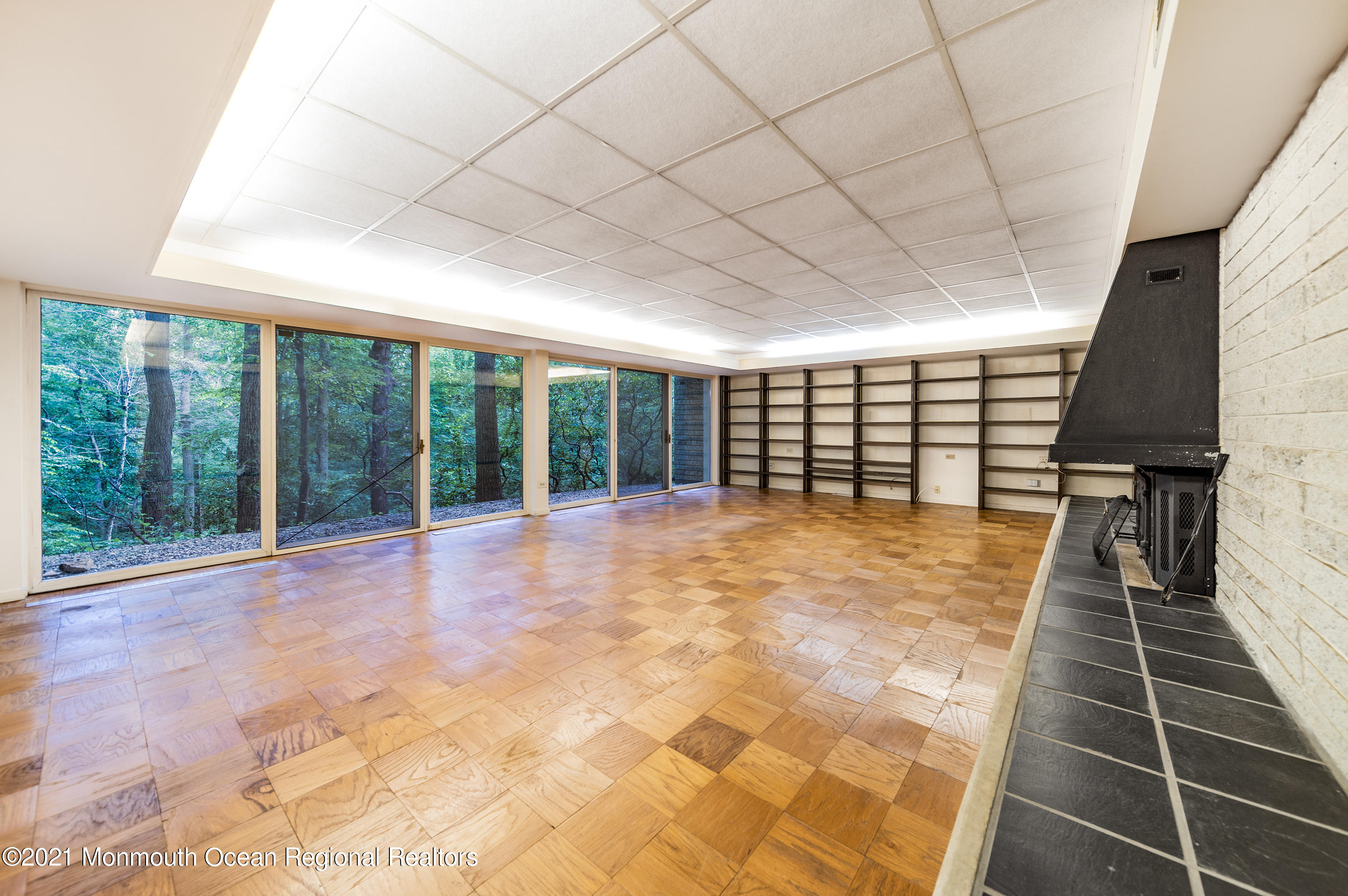 277 Mc Clees Road Red Bank, NJ 07701 - Photo 35 of 53 a view of an empty room with wooden floor and a window