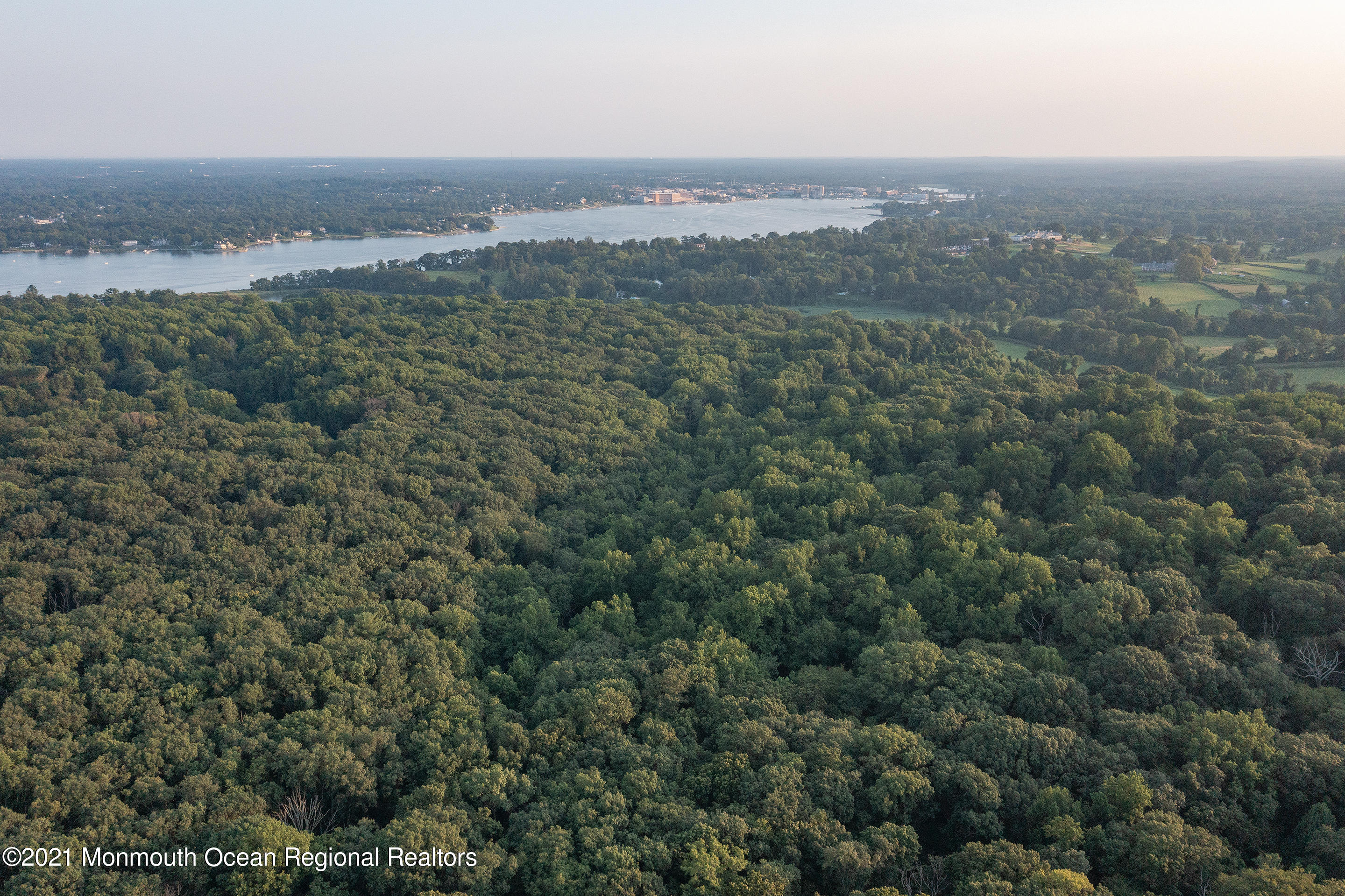 277 Mc Clees Road Red Bank, NJ 07701 - Photo 46 of 53 an aerial view of town with trees and houses